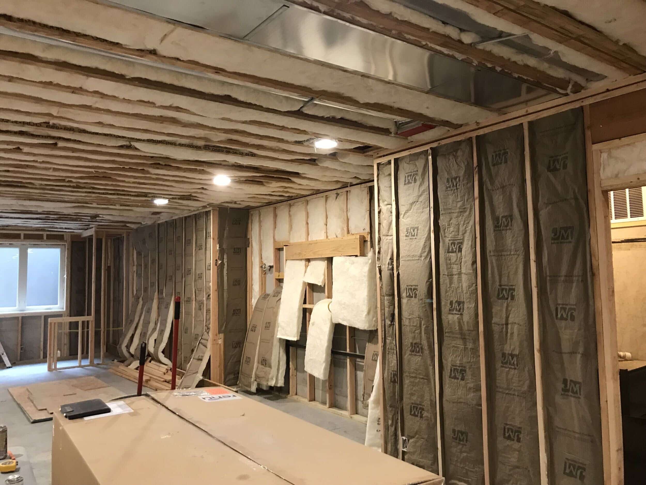 foam insulation now fills the gaps between the frame boards to help with maintaining temperature in the basement area