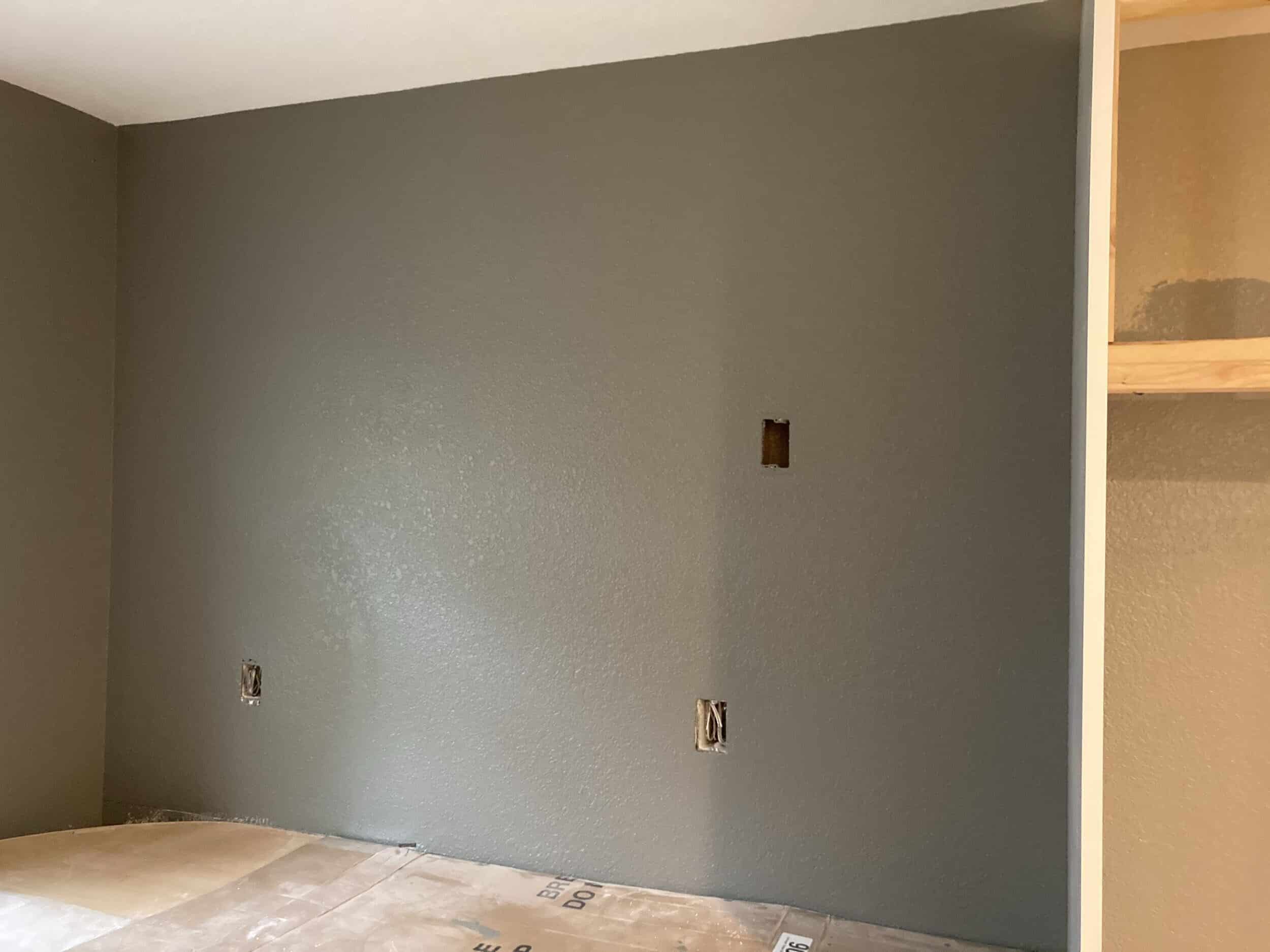 added a texture to the walls and painted with a dark grey shade to add some depth and dimension