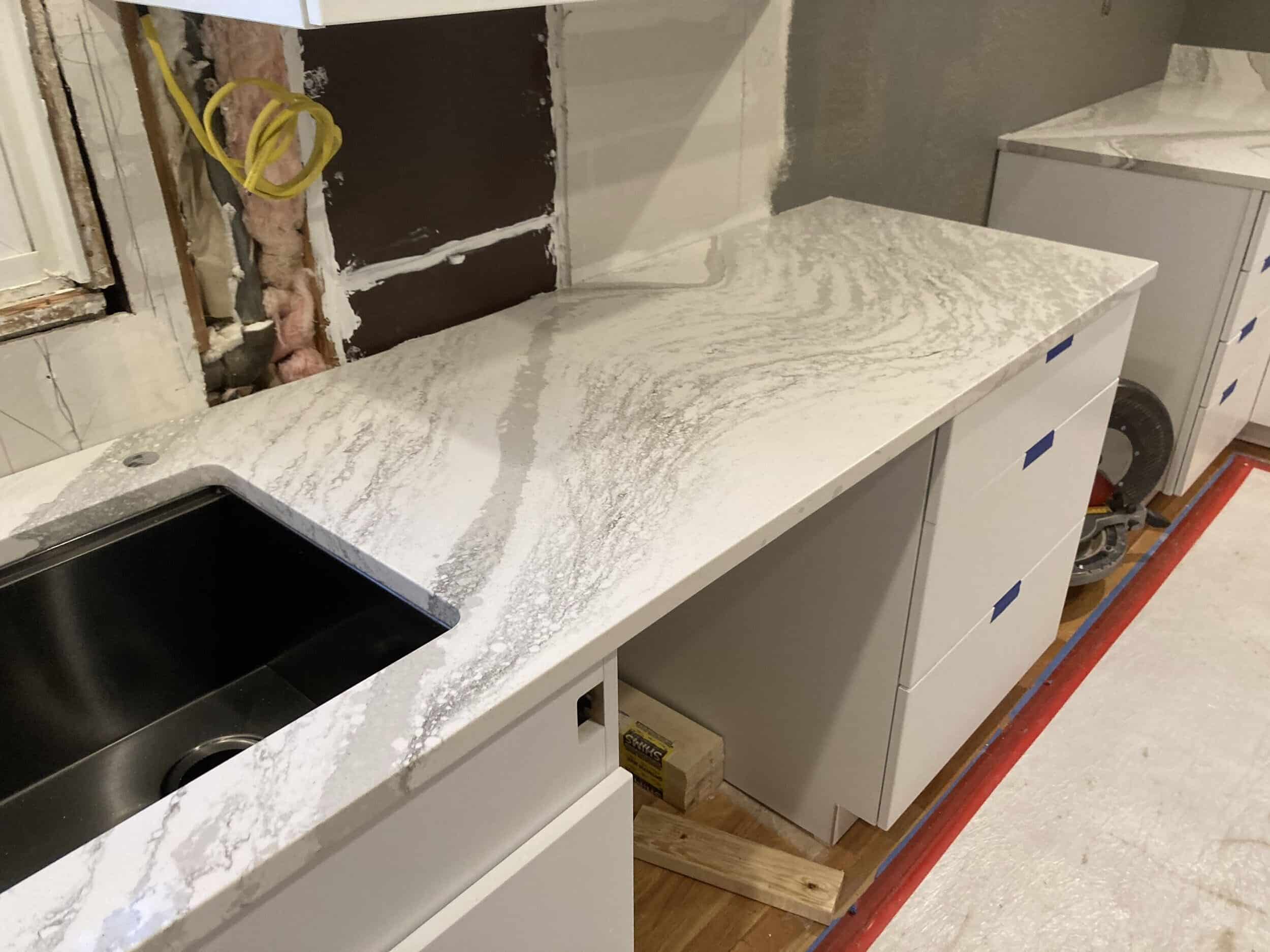 cambria quartz counters installed they are white with some subtle grey ish veining