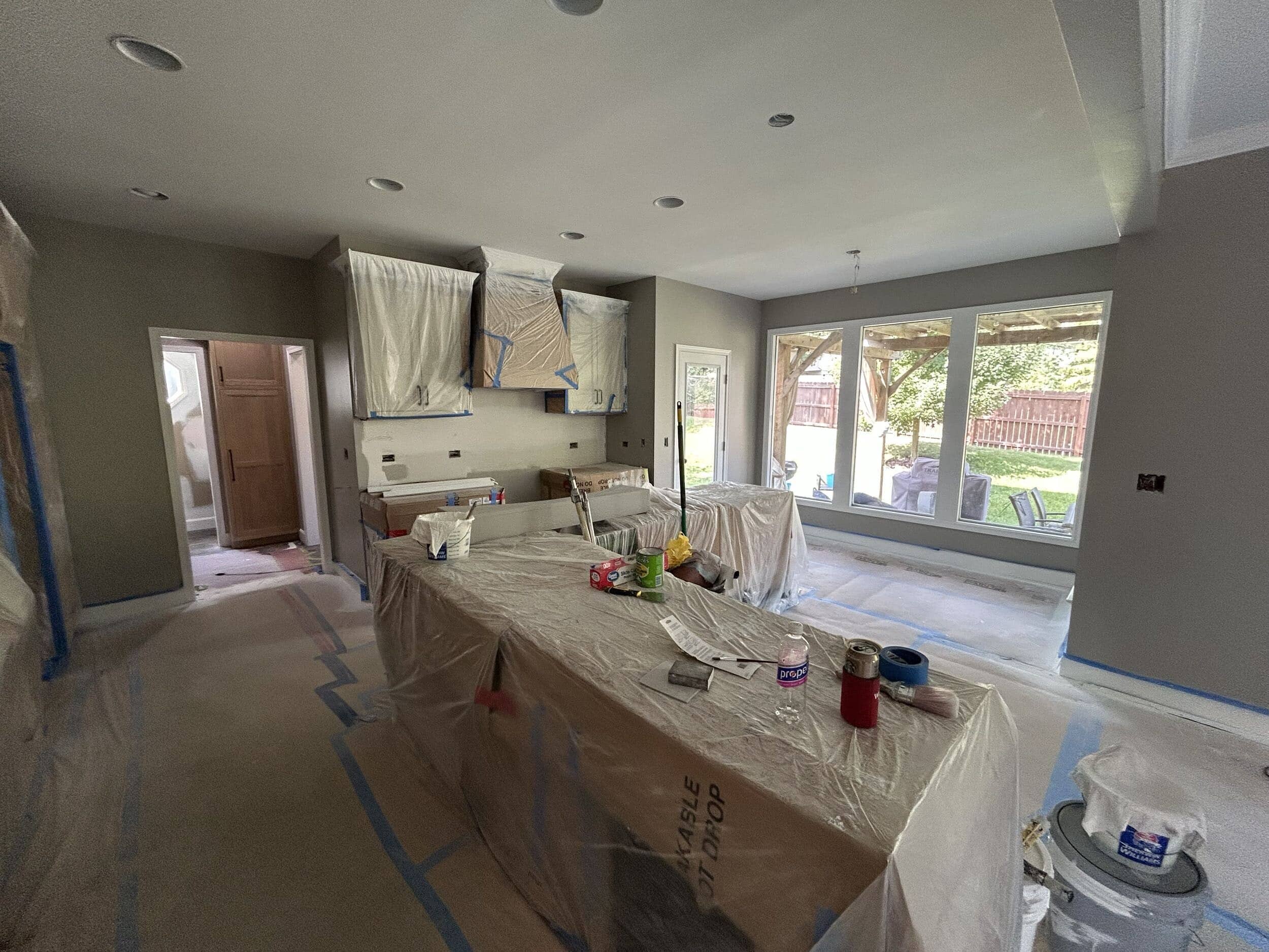 cabinets covered and walls freshly painted