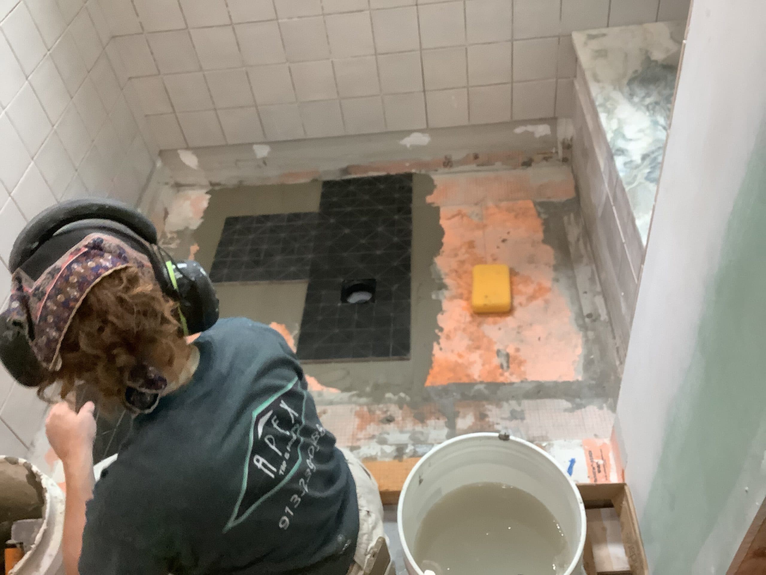 laying shower floor tile in fairway kansas primary bathroom remodel