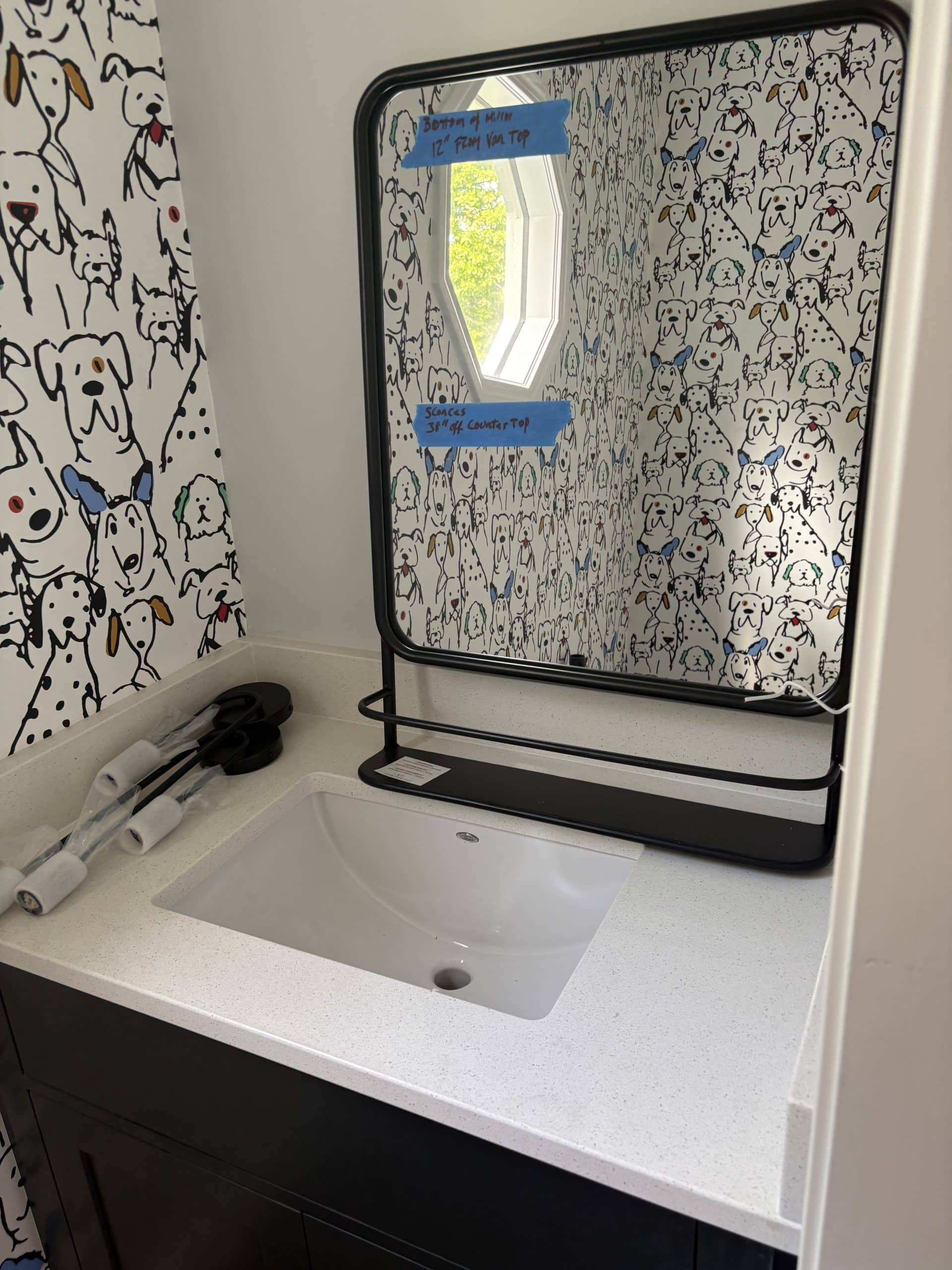 fun dog printed wallpaper just hung in the powder bath and the new white coutners in 
