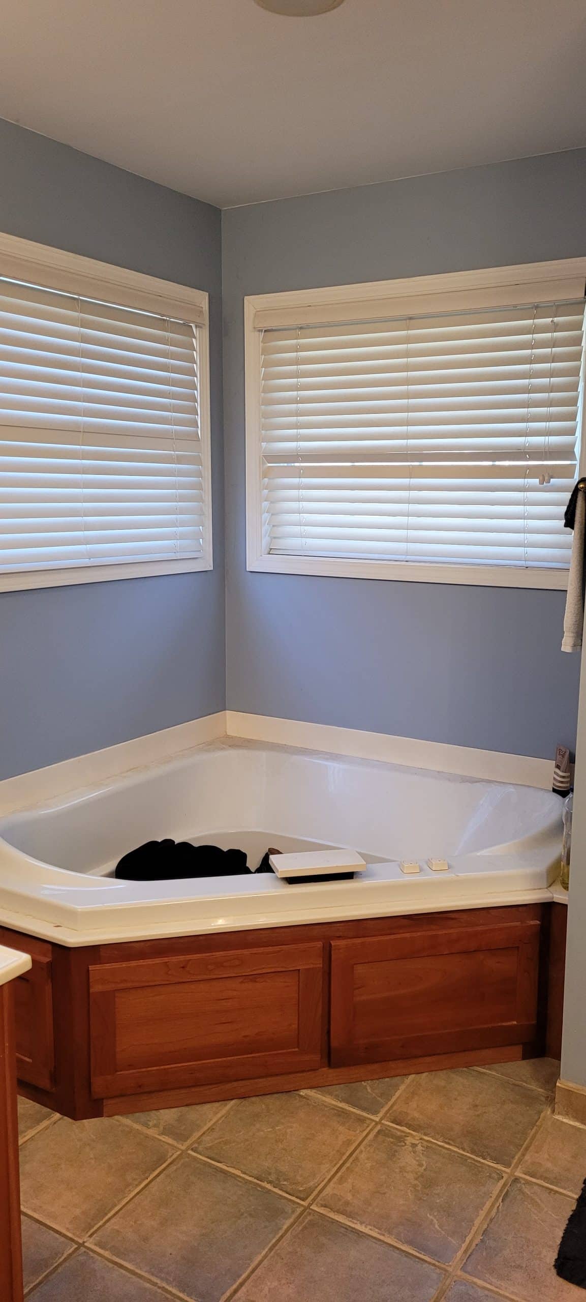 corner tub with windows on each corner wall above before the remodel in fairway