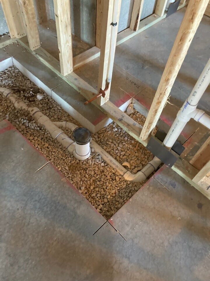 plumbing and water hook up for new basement kitchen and bathroom in plumbing and electrical rough in phase of construction for the basement remodel in Riverside