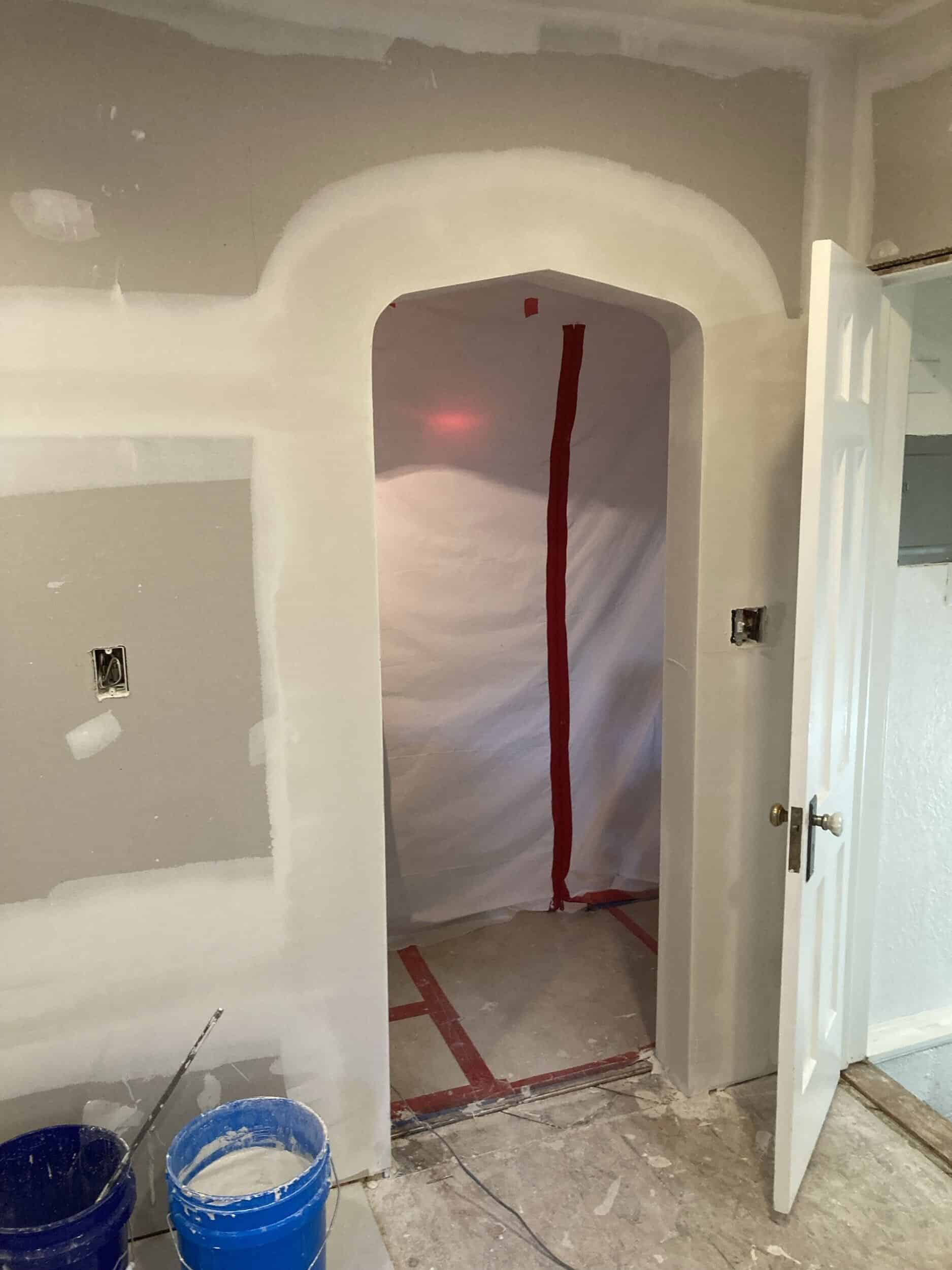 arched entryway into kitchen custom built to match others in the armour hills kcmo historic home