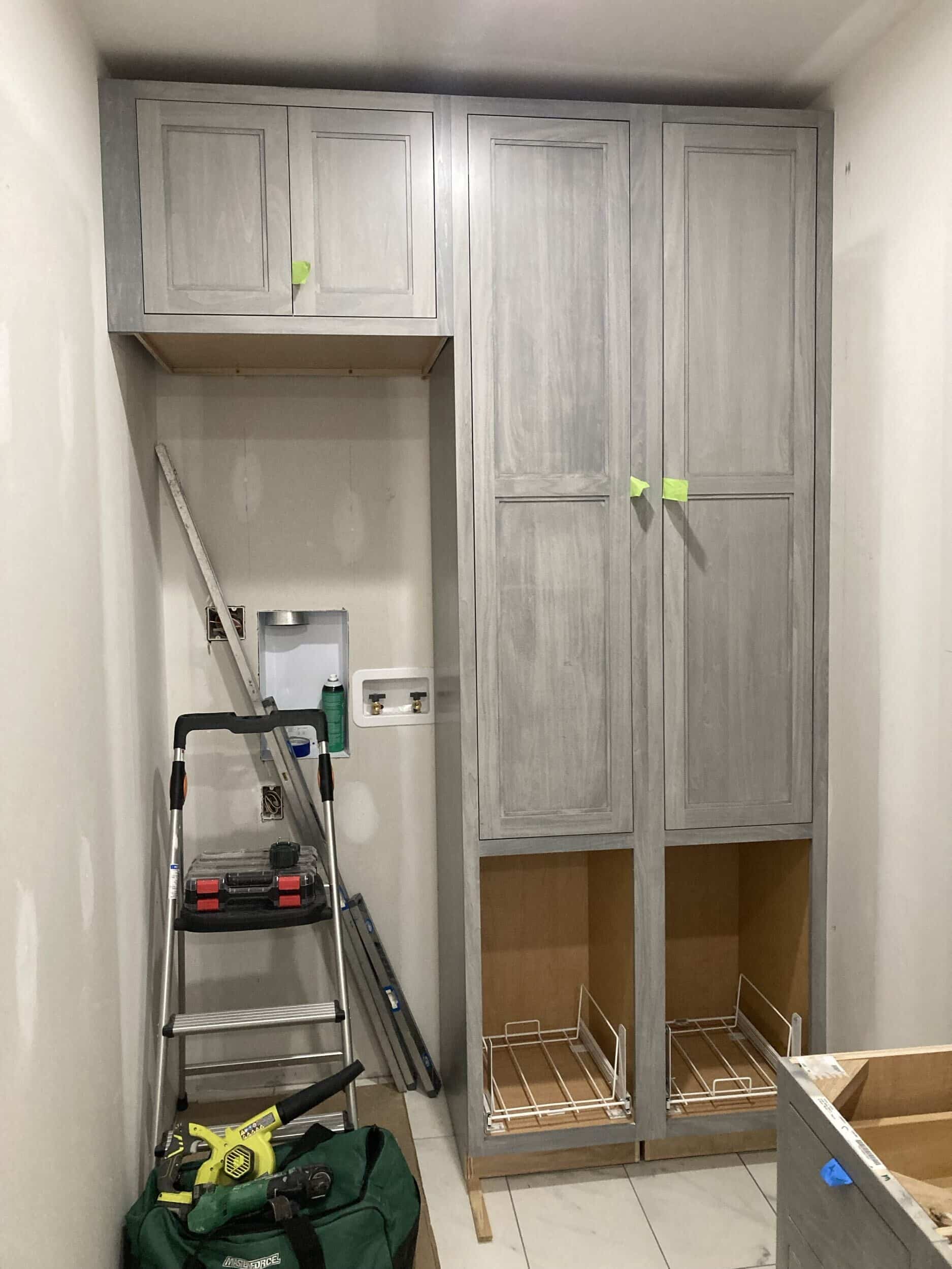 cabinets being installed at our lee's summit handyman services remodeling project for the mudroom and laundyroom remodel