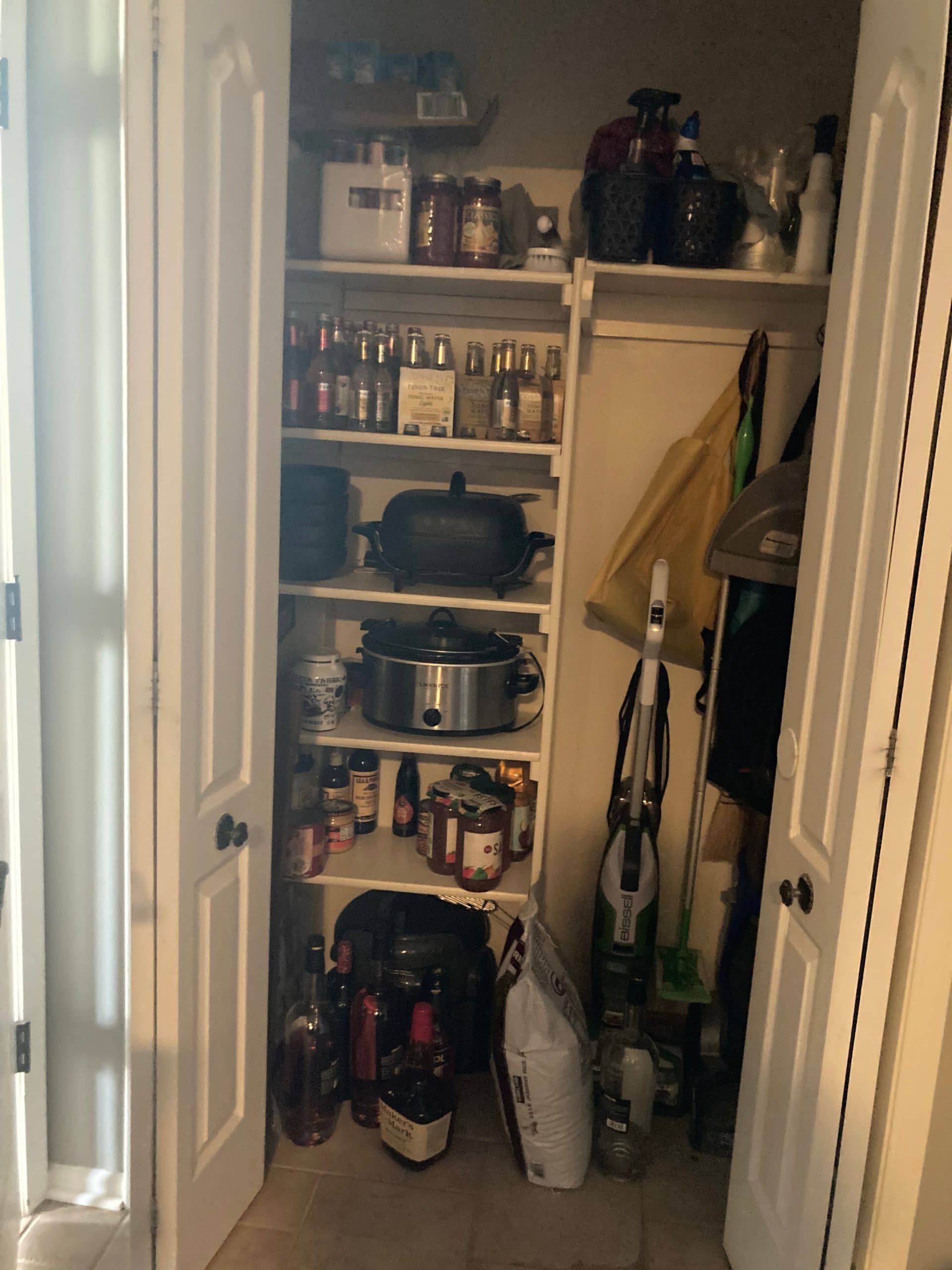 cluttered closet before remodel
