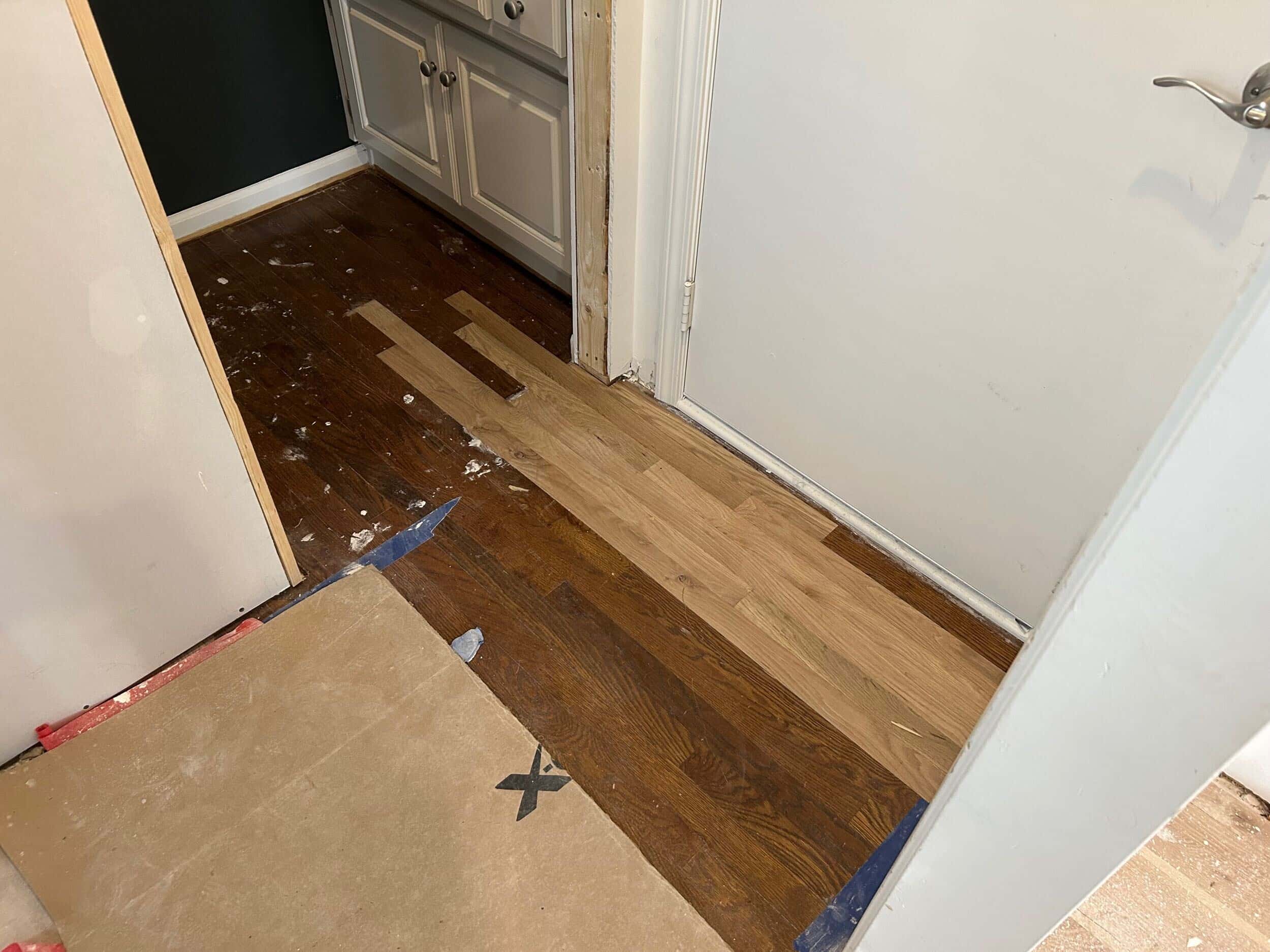 existing hardwood floors patched in to fill gaps ready to be sanded