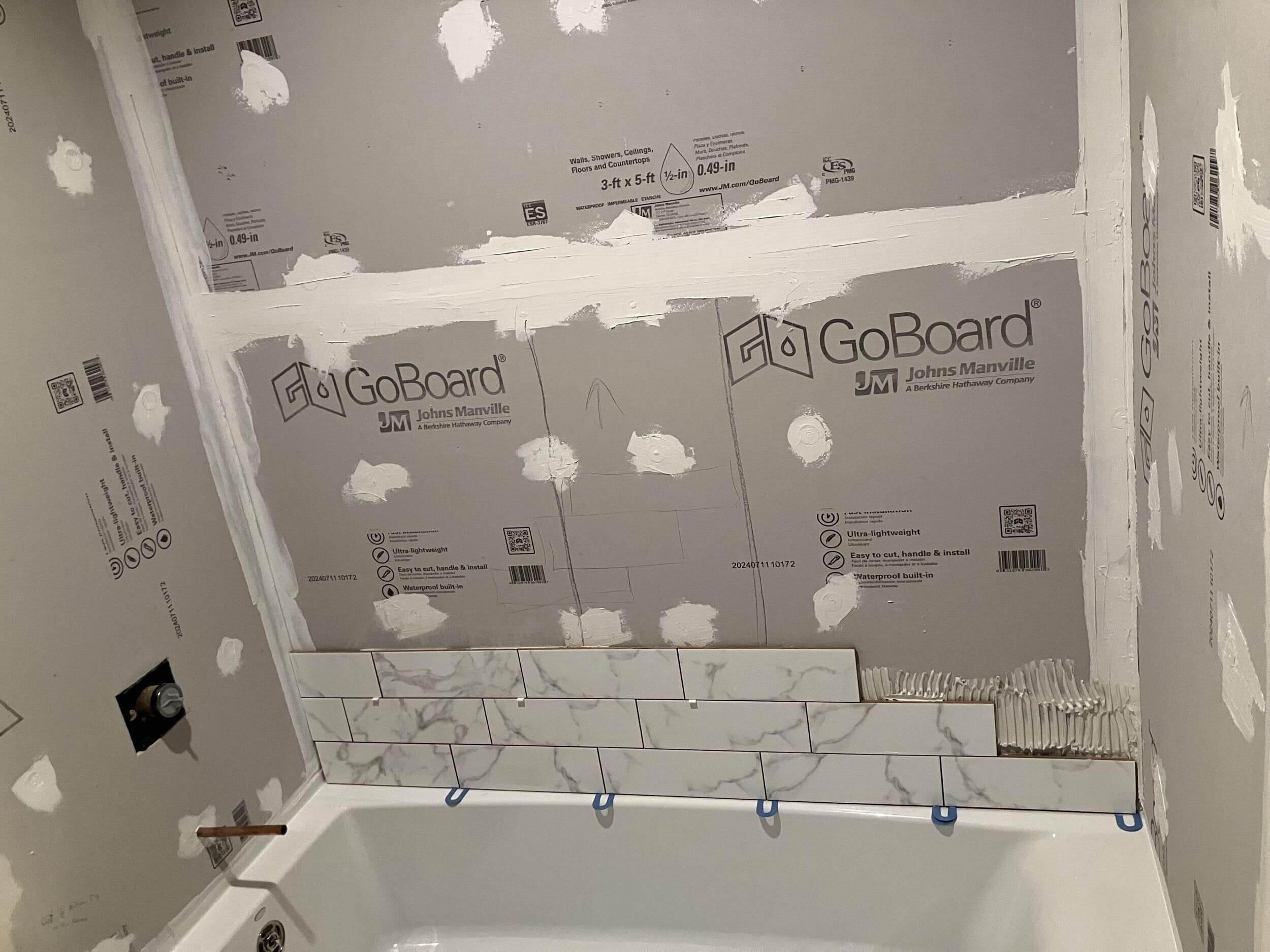 tile backer board installed in tub shower remodeling project completed by handyman team while keeping rest of existing bathroom