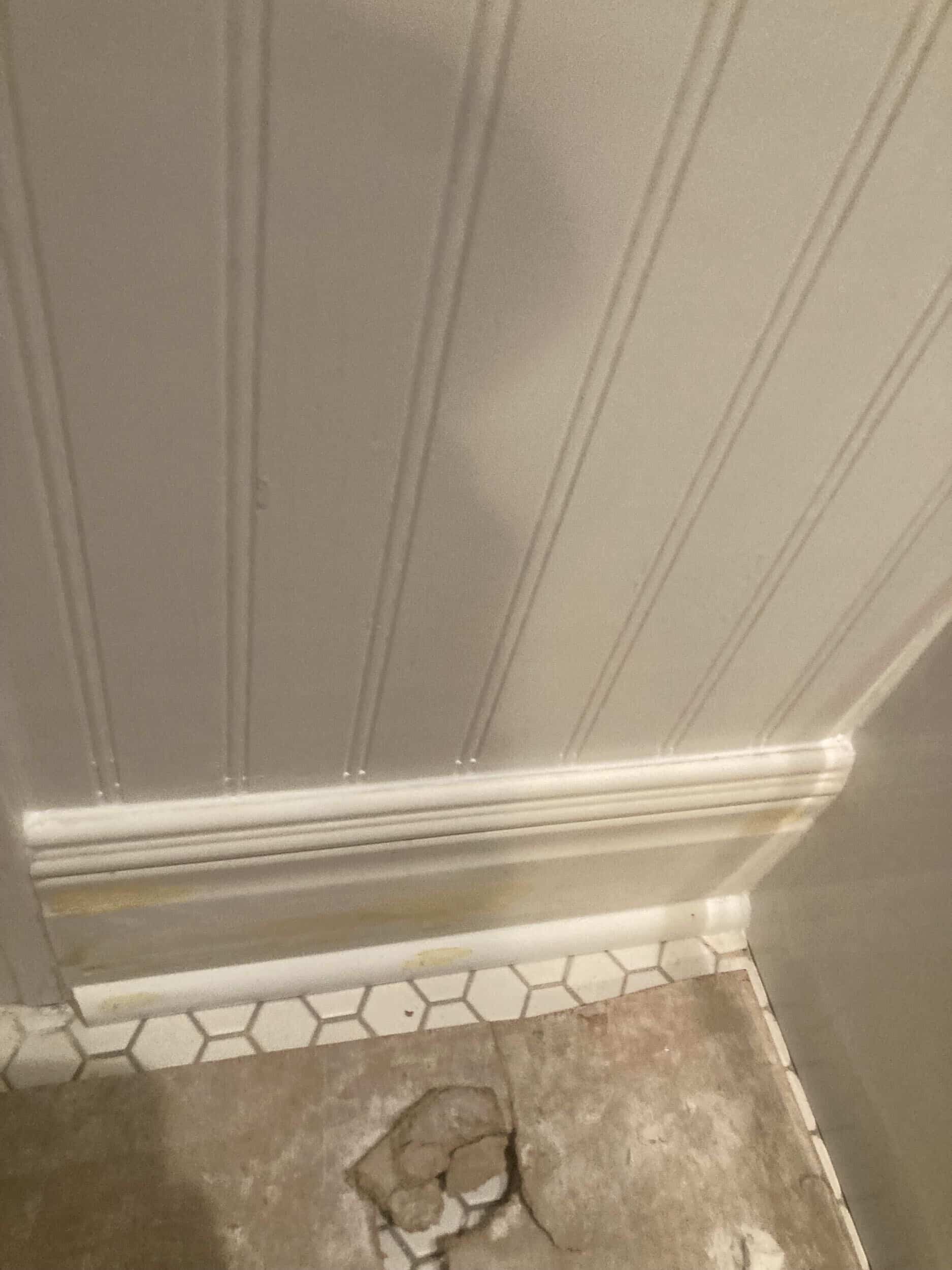 wainscoting replaced for seamless look in handyman bathroom remodel 