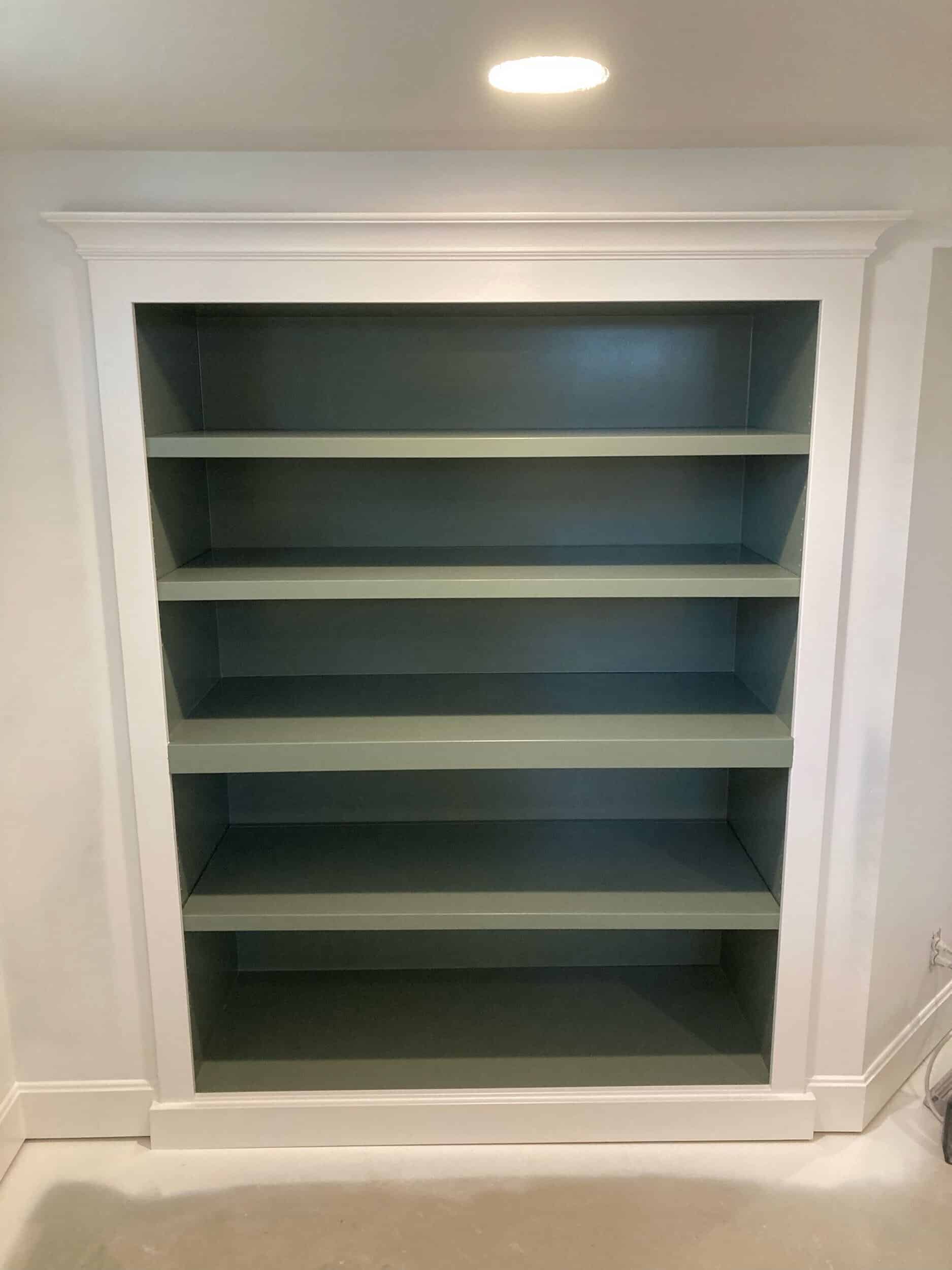 built-in shelves are painted the same fun shade of light sage green that we used for the cabinetry in the mudroom to help keep the space cohesive. 