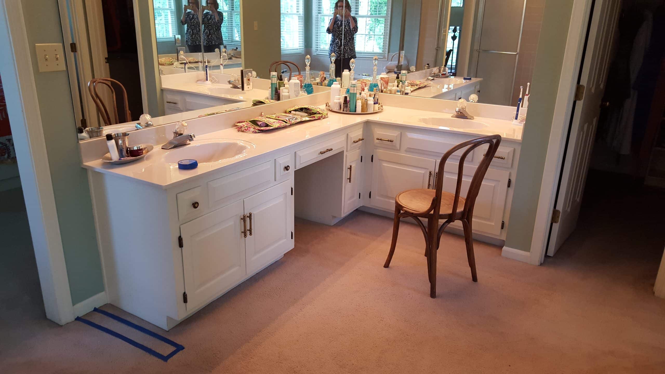 dated primary bathroom before a remodel but with good cabinetry that will be reused