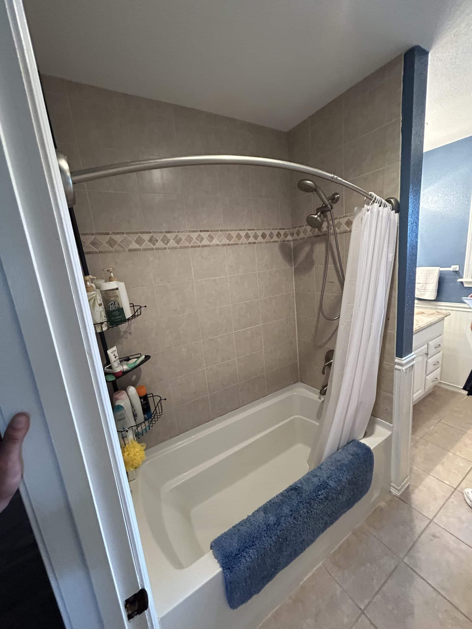 dated tub shower combo at lake of the ozarks remodeling project before handyman team replaced everything for safe aging in place