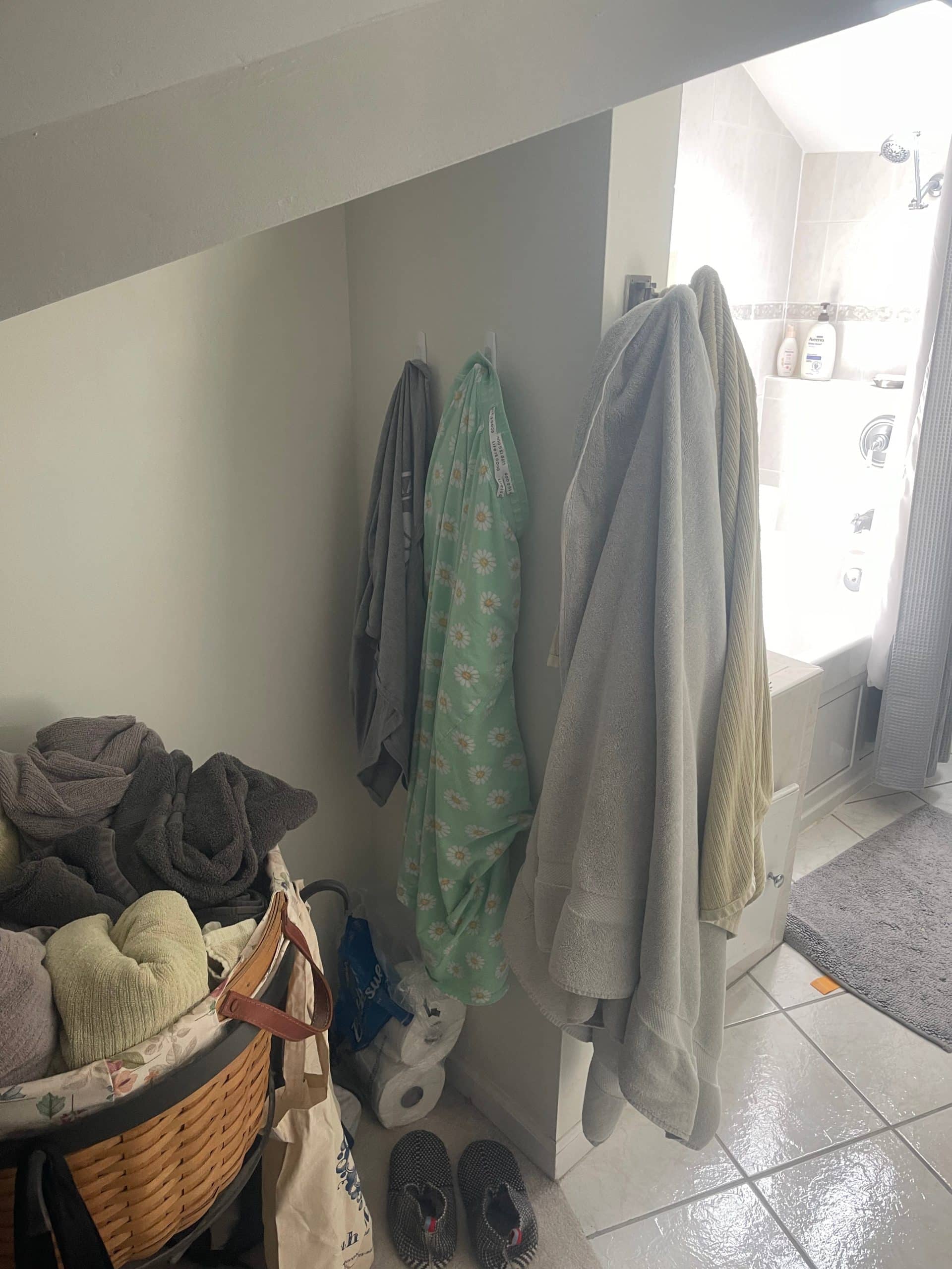 dated bathroom before the remodel showing cramped weird layout and dated finishes