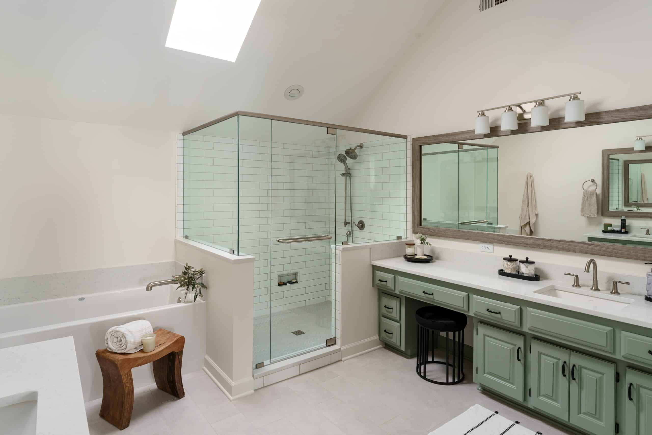 bathroom with existing cabinetry painted a light sage green color to achieve a modern feel without ripping out the cabinetry 