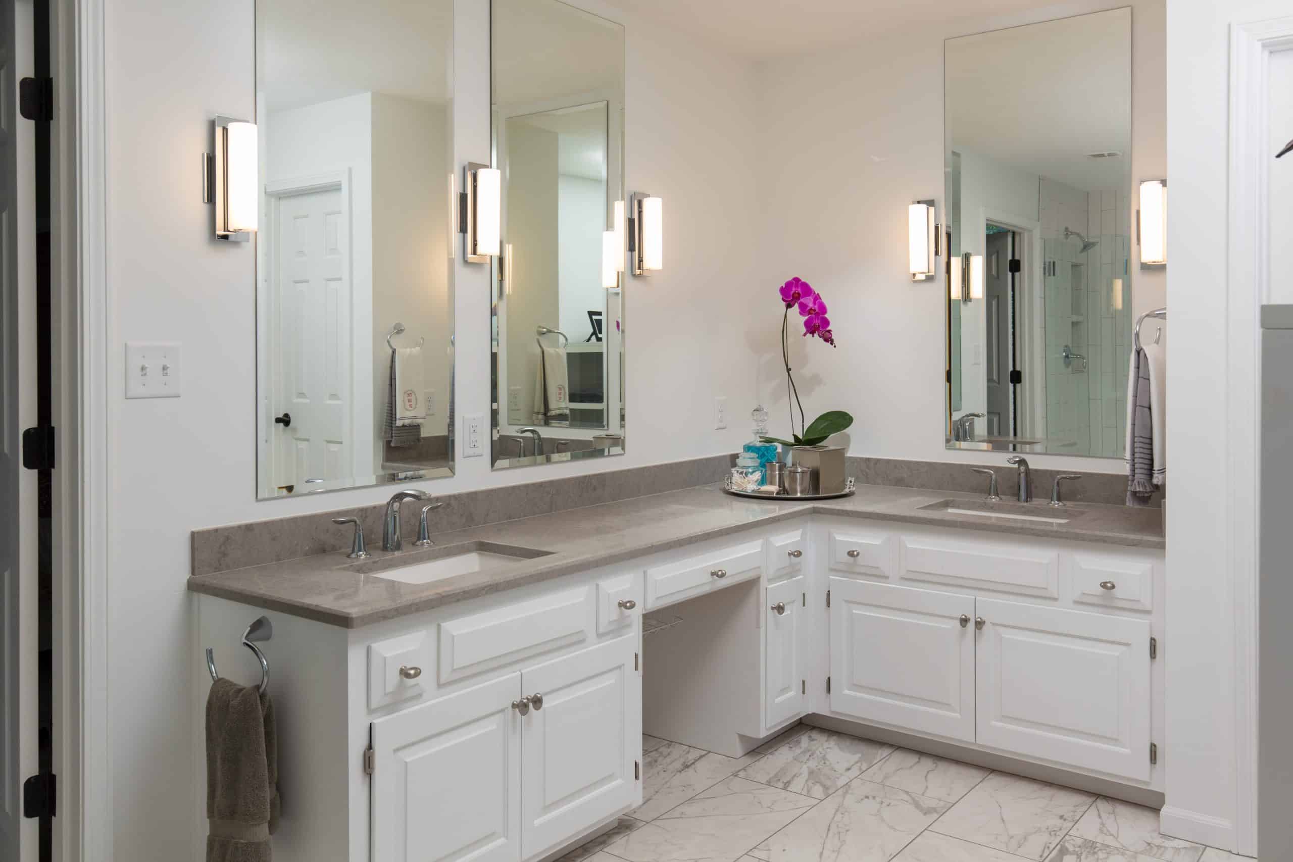 existing primary bathroom cabinetry at vanity that has been refreshed with modern counters and accents