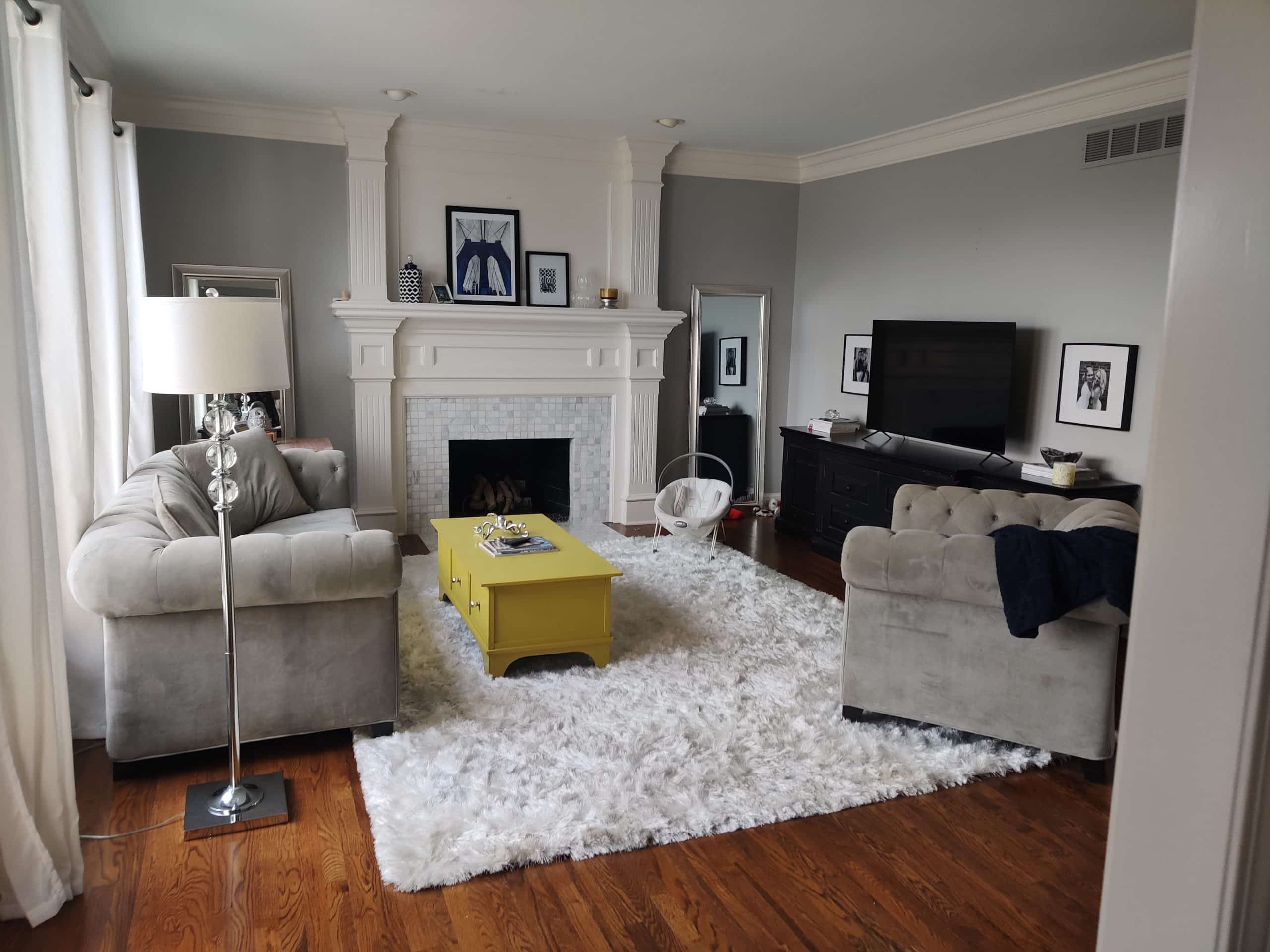 dated traditional and classic family room before the remodel. the space is very cool toned and feels cold and sterile