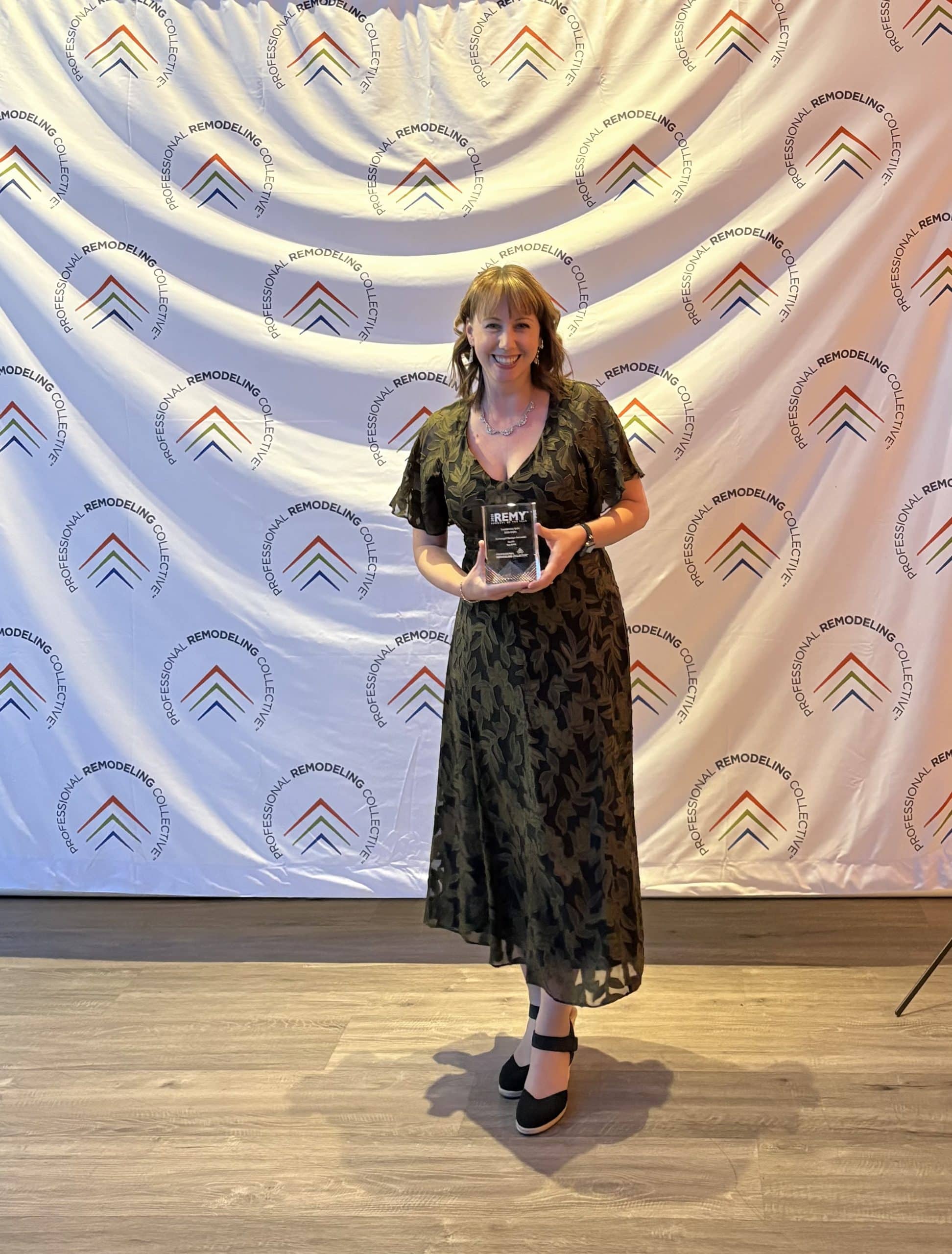 maggie stephenson at remy awards accepting award for schloegel design remodel