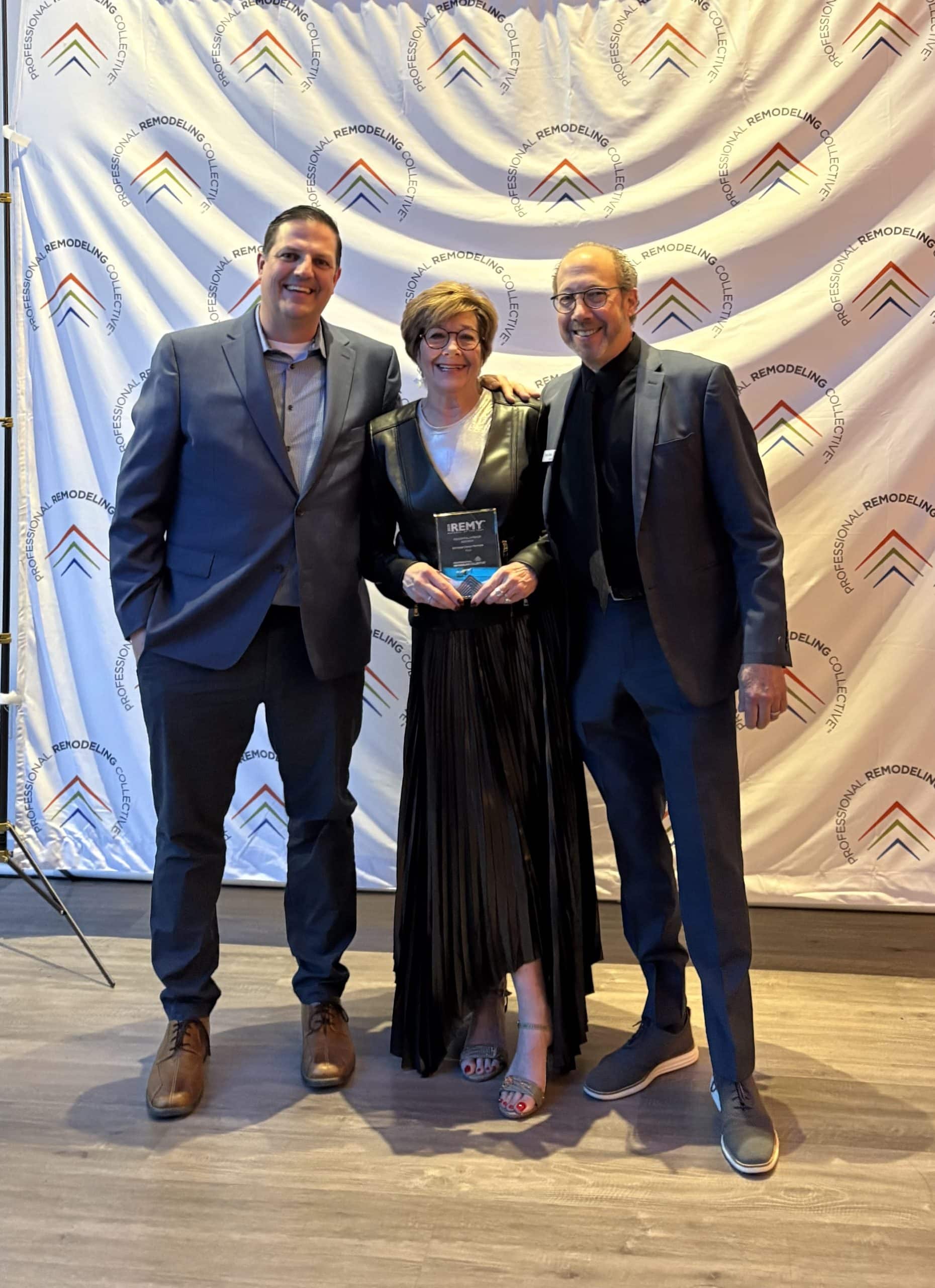 Donna kirsopp kenny choikhit and andy gower at the remy awards accepting an award for schloegel design remodel