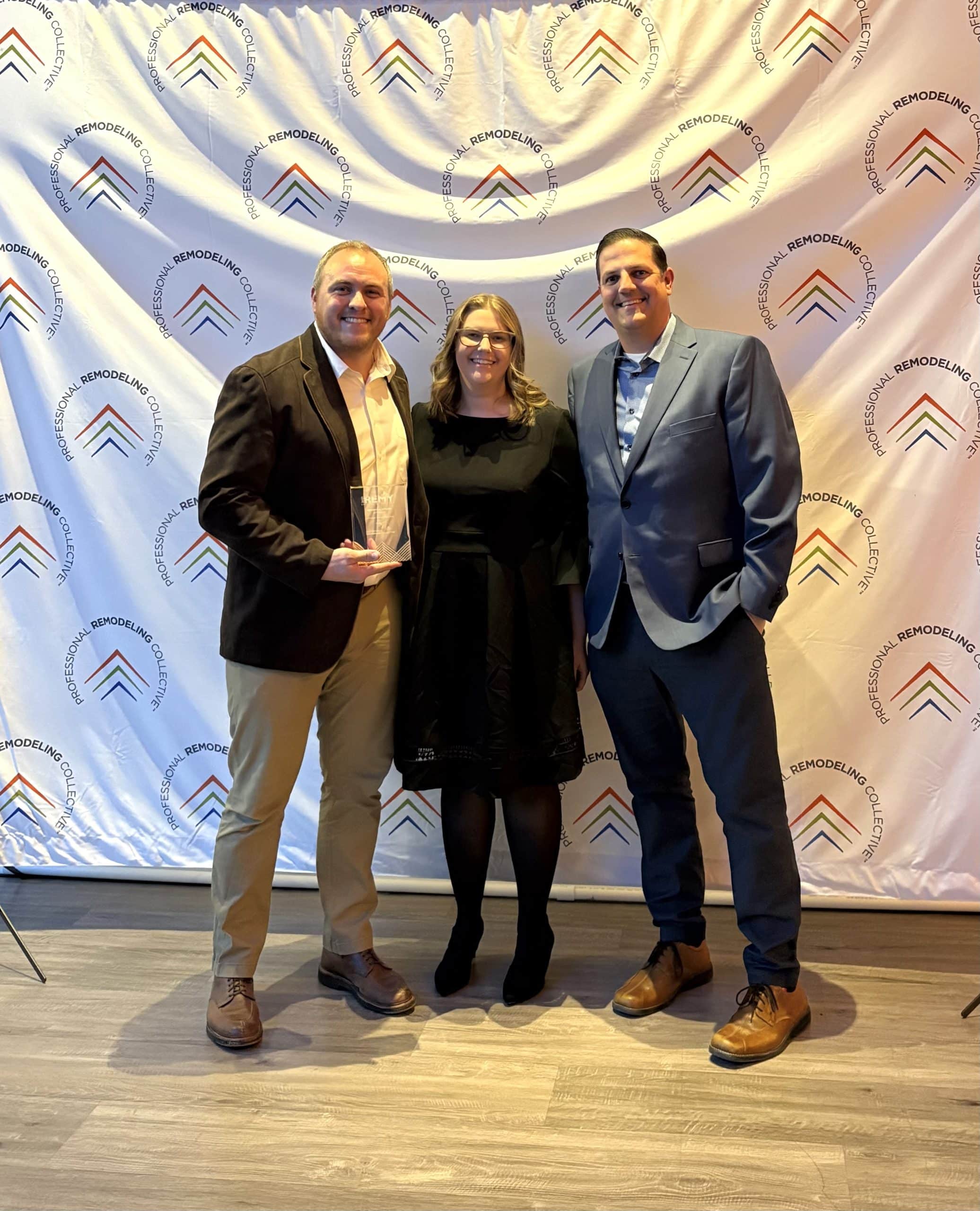 brandon brewington and andy gower and nina schmidt at remy awards