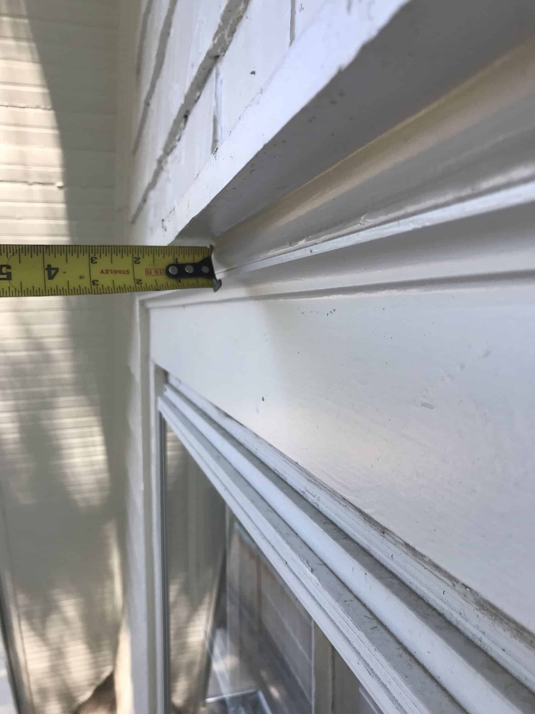 measuring for level measuring to ensure everything on the trim and window area is level and flush