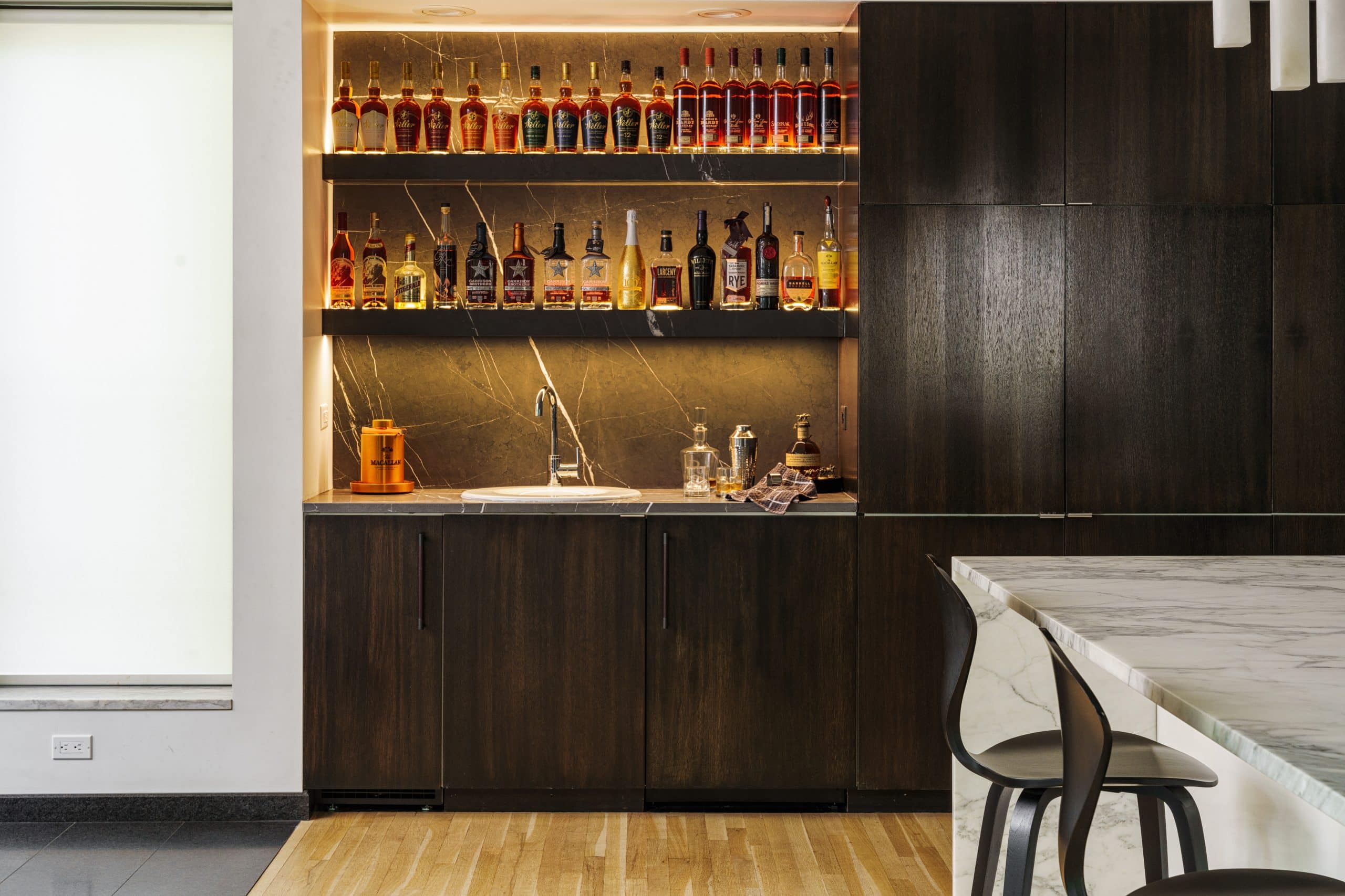 full height slab backsplash in custom bar