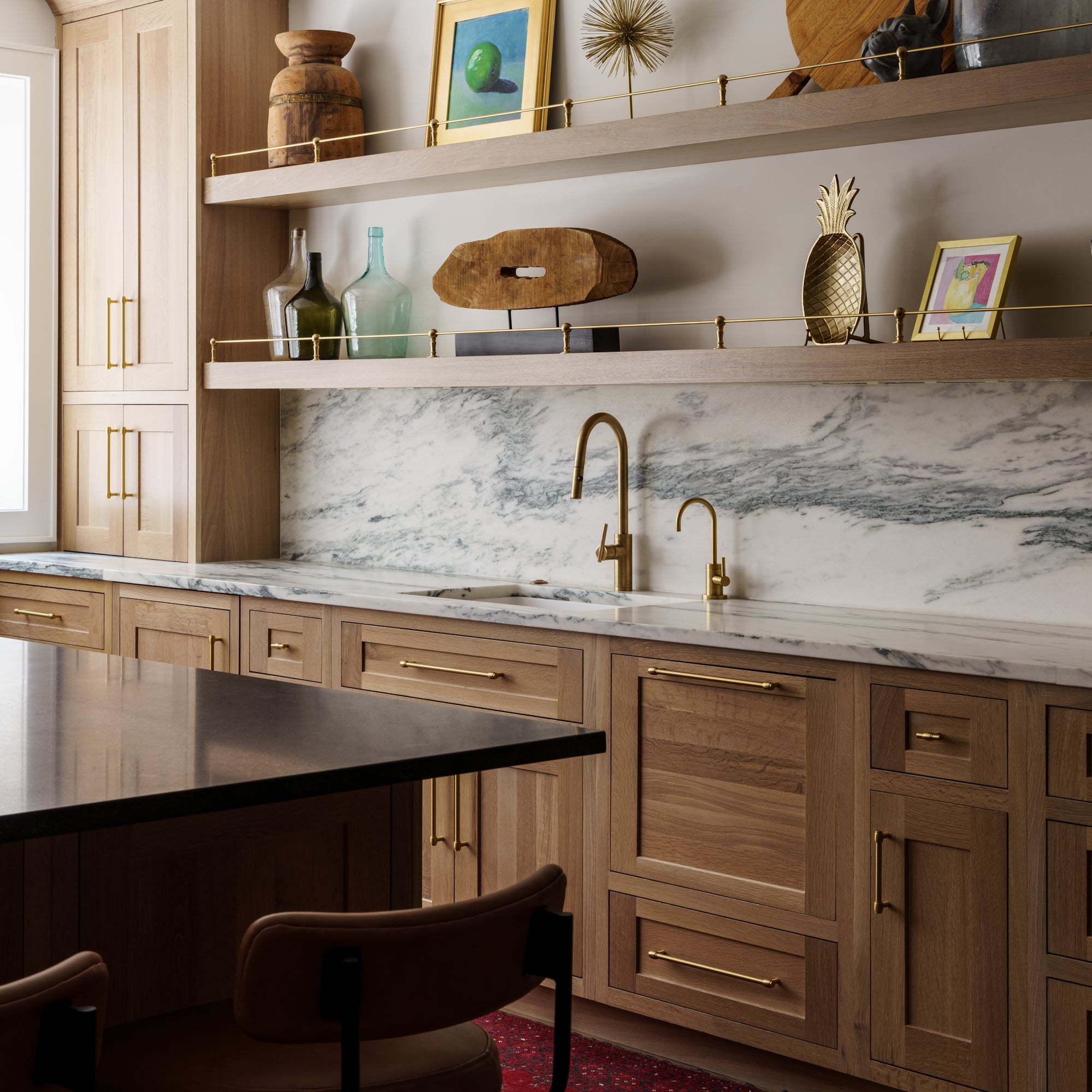 Basement kitchen with marble backsplash and white oak cabinets