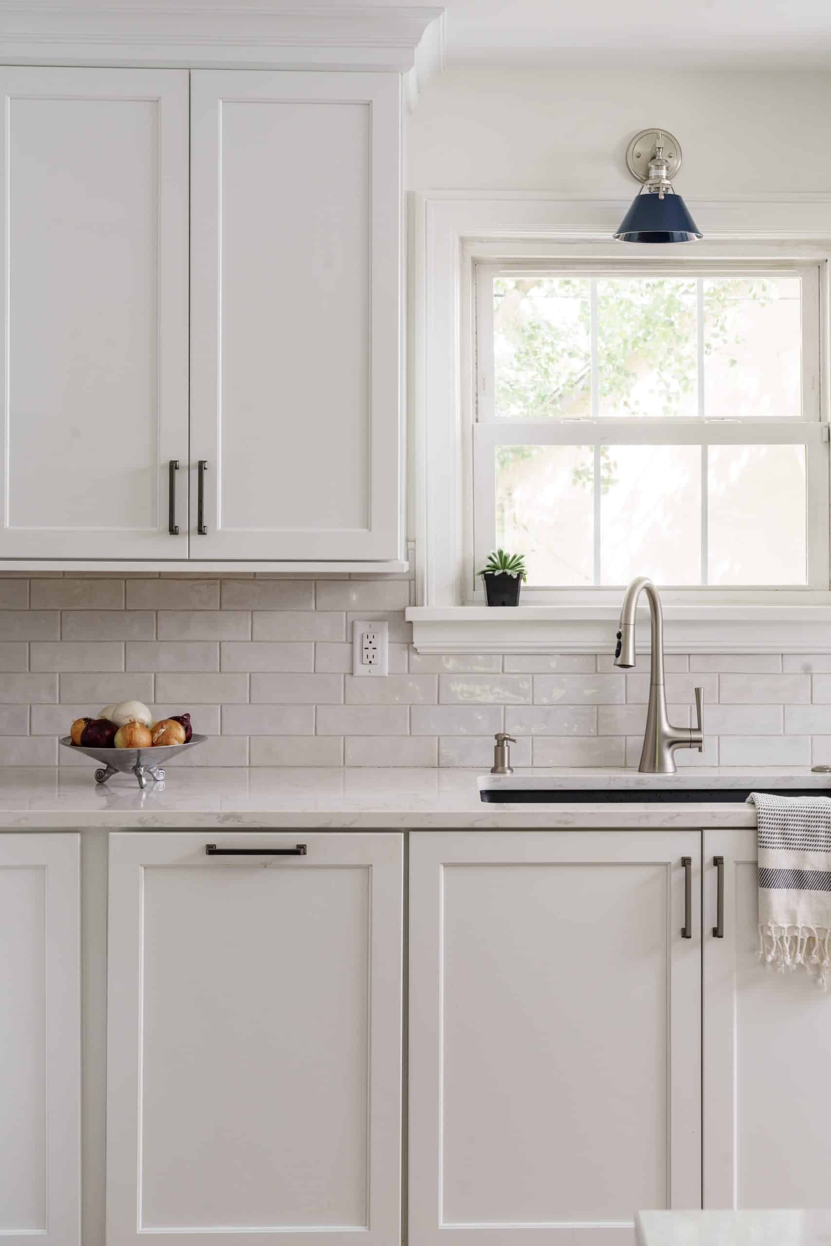 close up of white kitchen sink and window close up of white kitchen sink and window