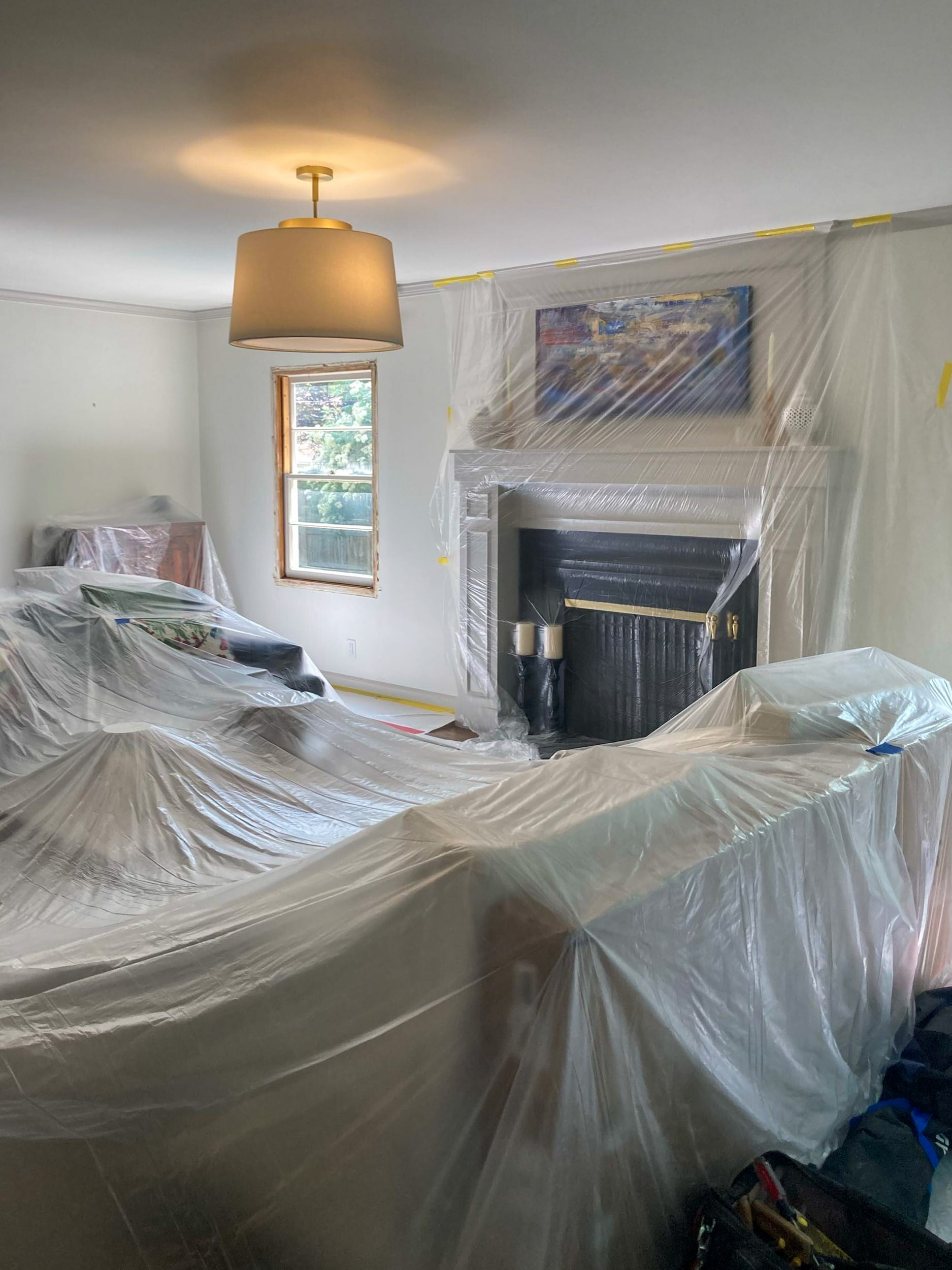 Dust and floor protection in living room for window replacement