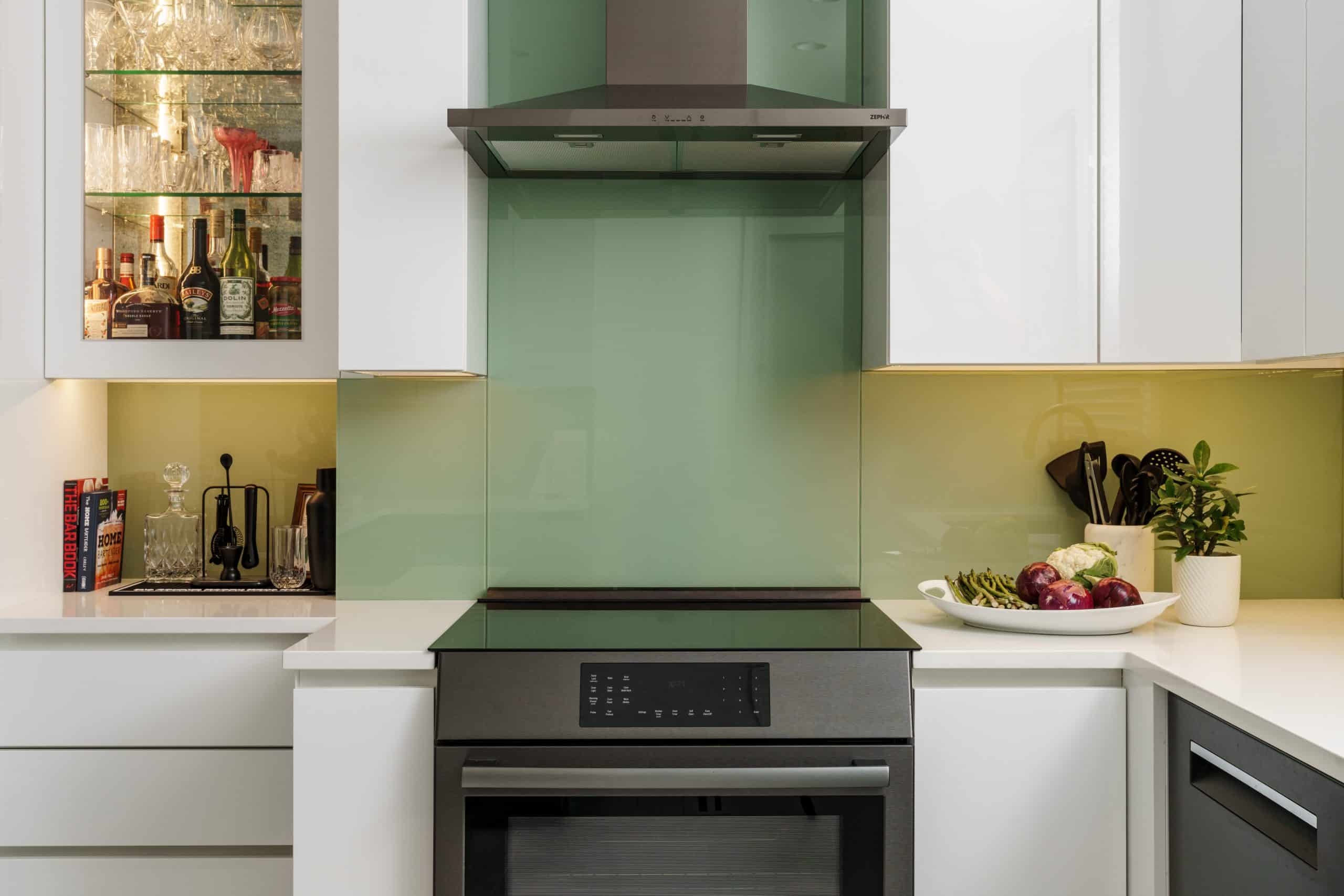 high gloss sleek green and white kitchen