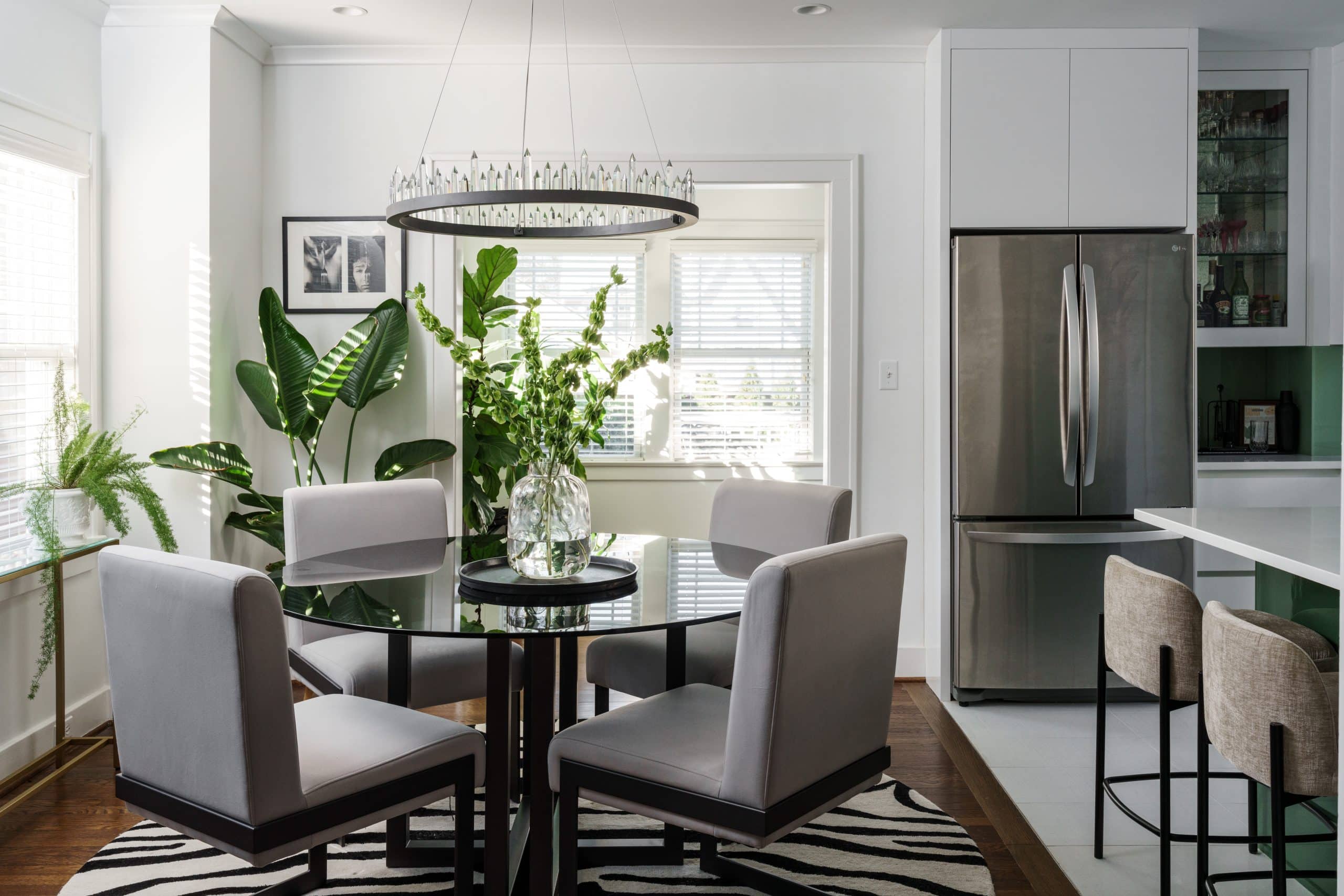 the dining area that blends the kitchen and back pantry storage in the modern brookside home remodel 