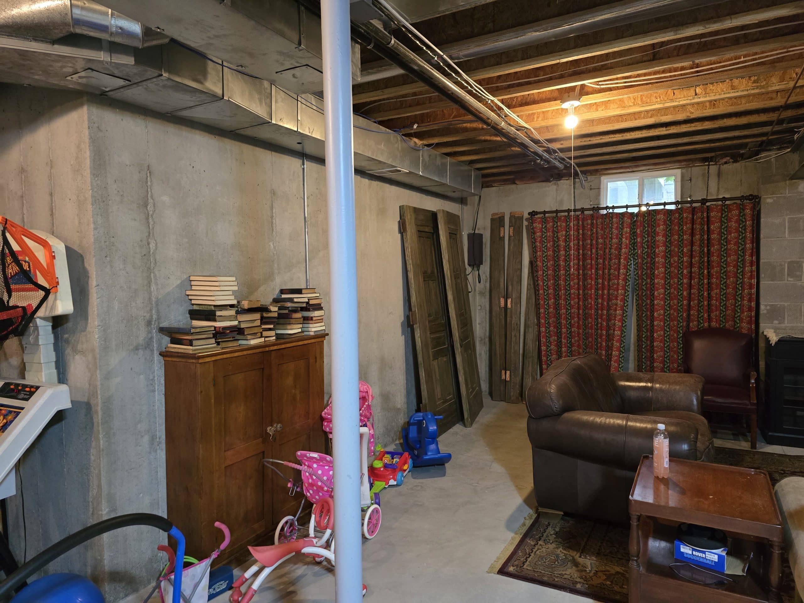 Unfinished basement before remodel