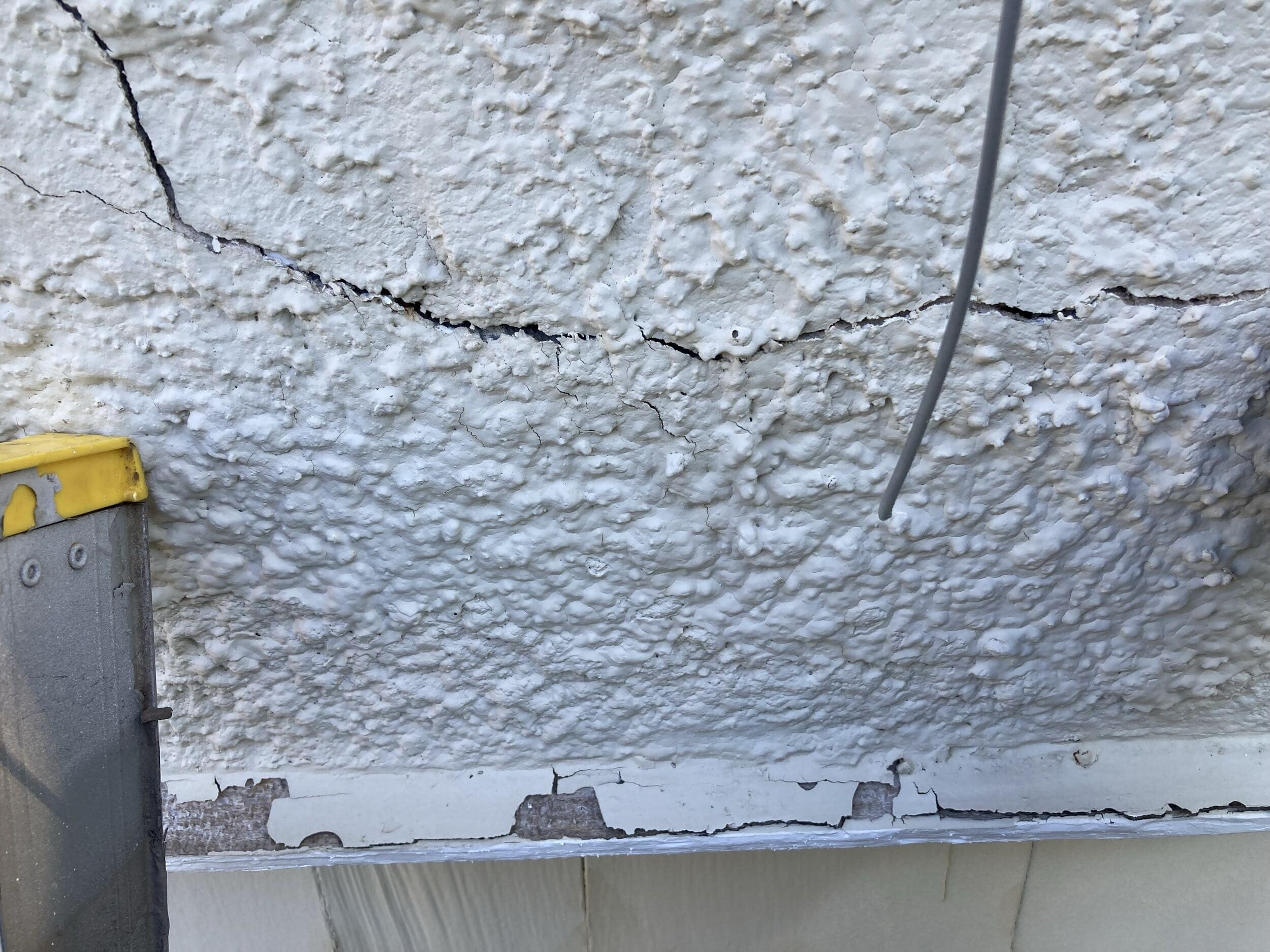 old chipping paint and wood rot in KCMO home