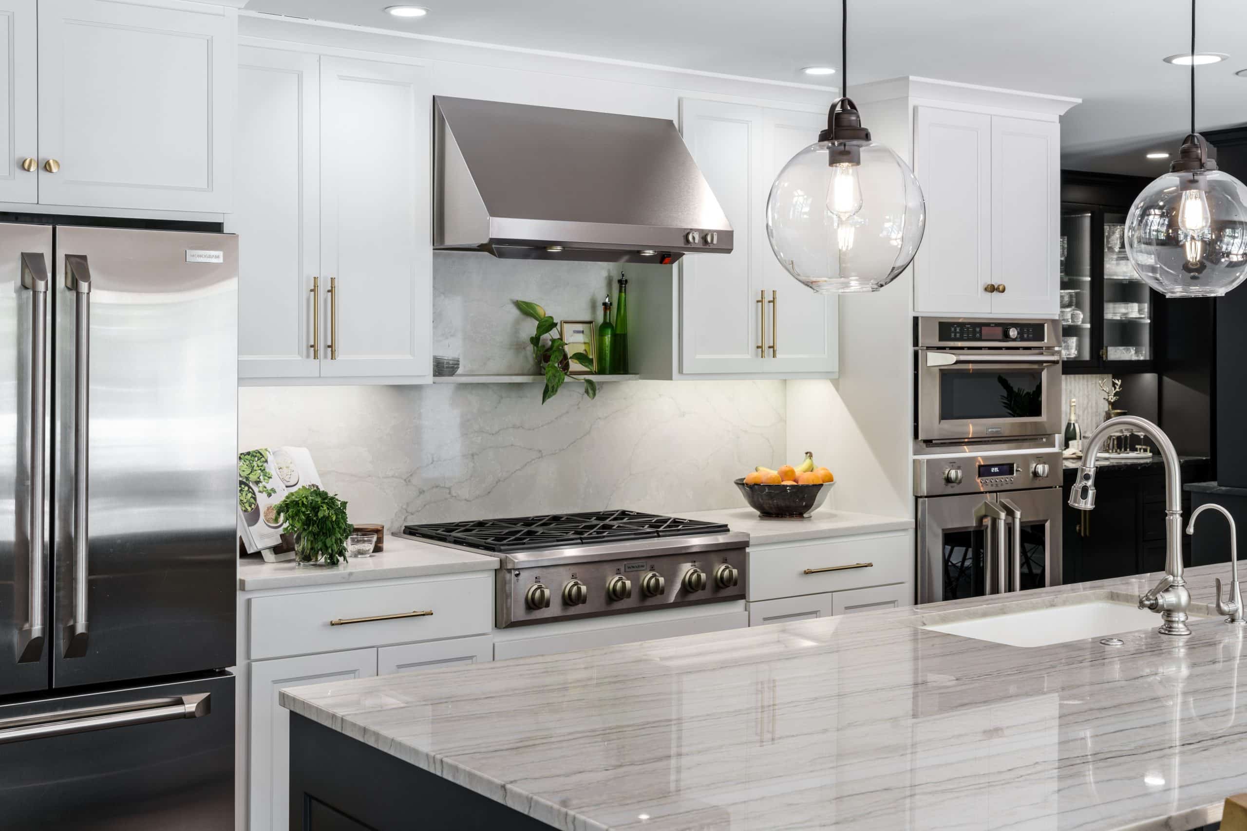 kitchen refresh in Leawood after storm damage kitchen refresh with new full heigh slab backsplash to match existing kitchen island counters