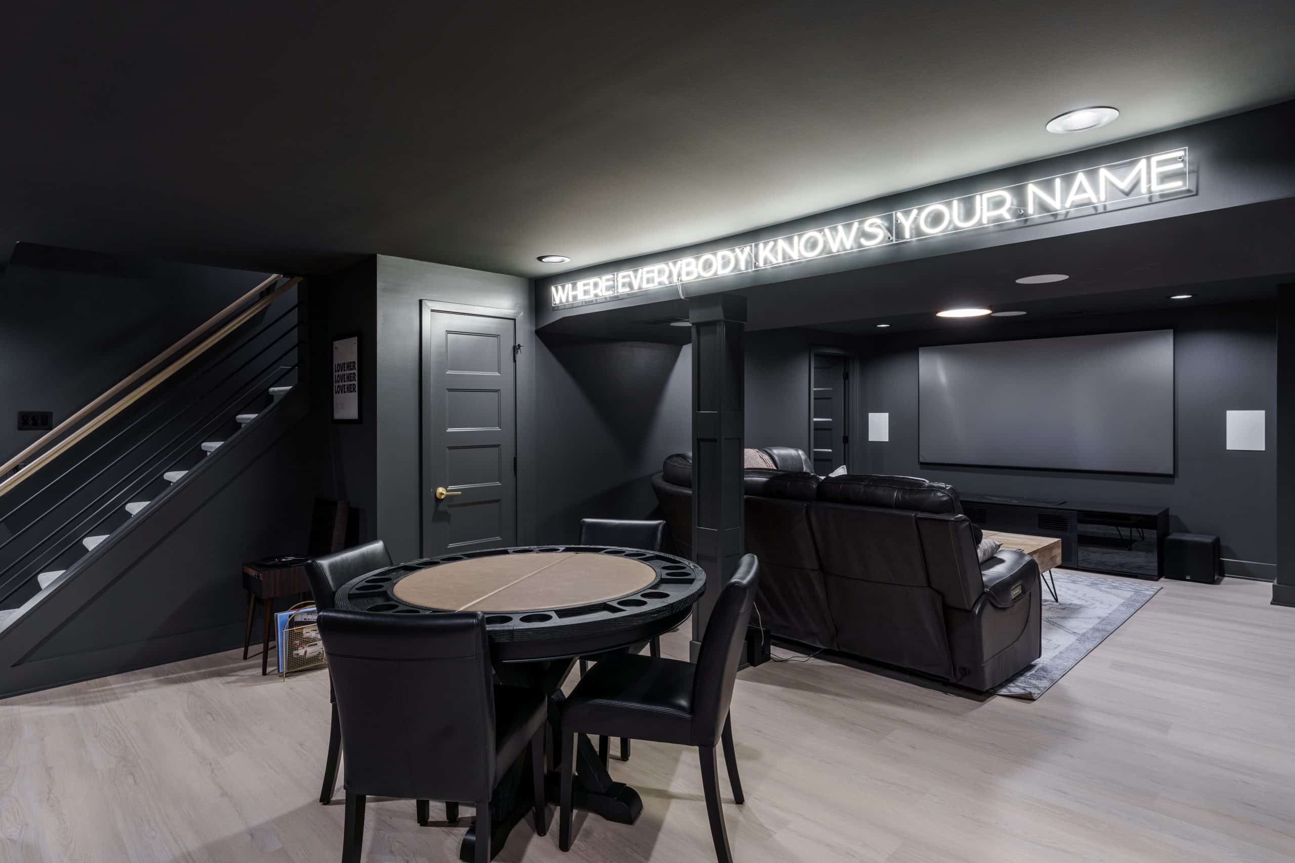 moody modern basement remodel in Leawood KS moody modern basement remodel with deep iron ore color drenching and white bright oak inspired LVT floors