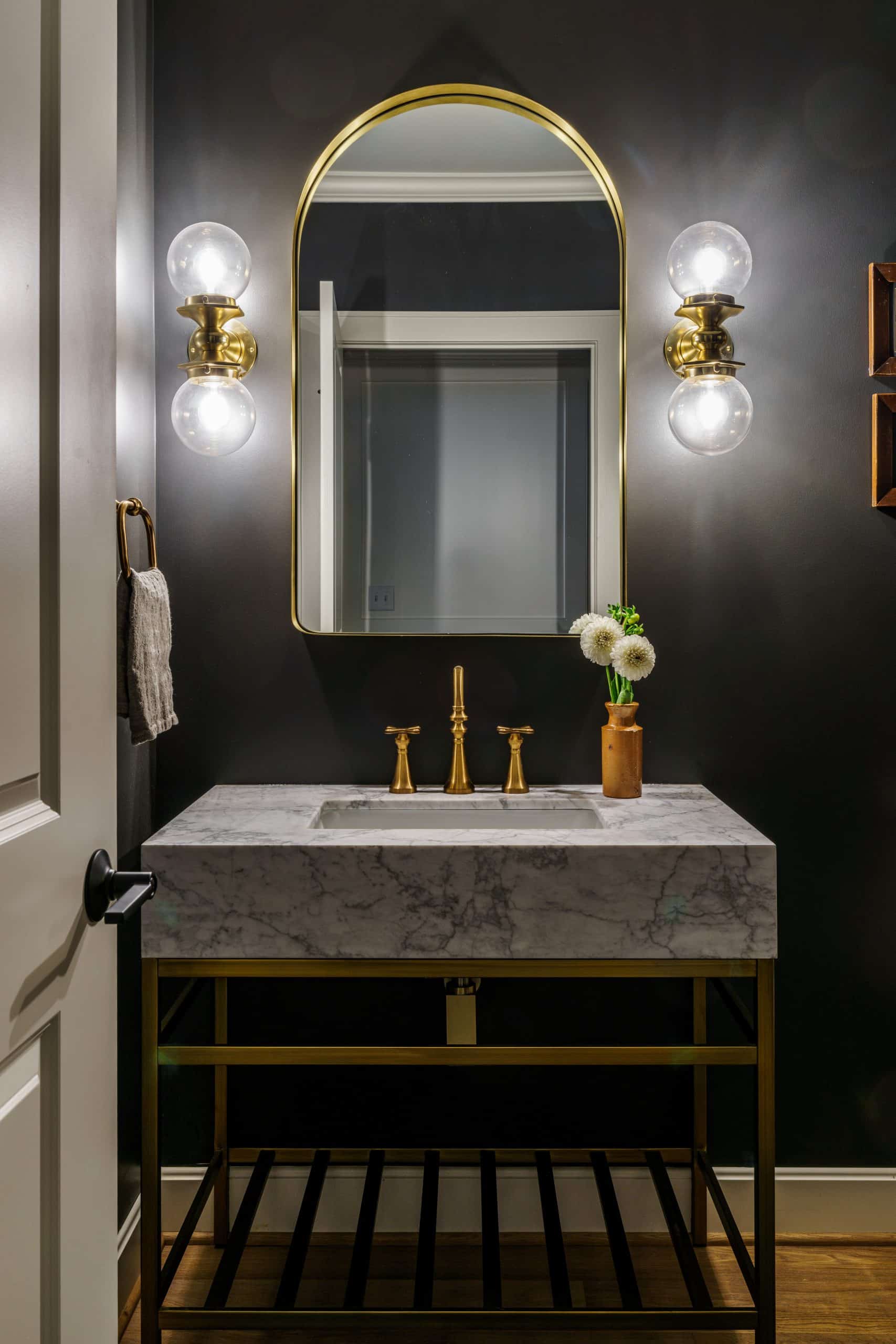 bold moody modern glam powder bathroom in basement