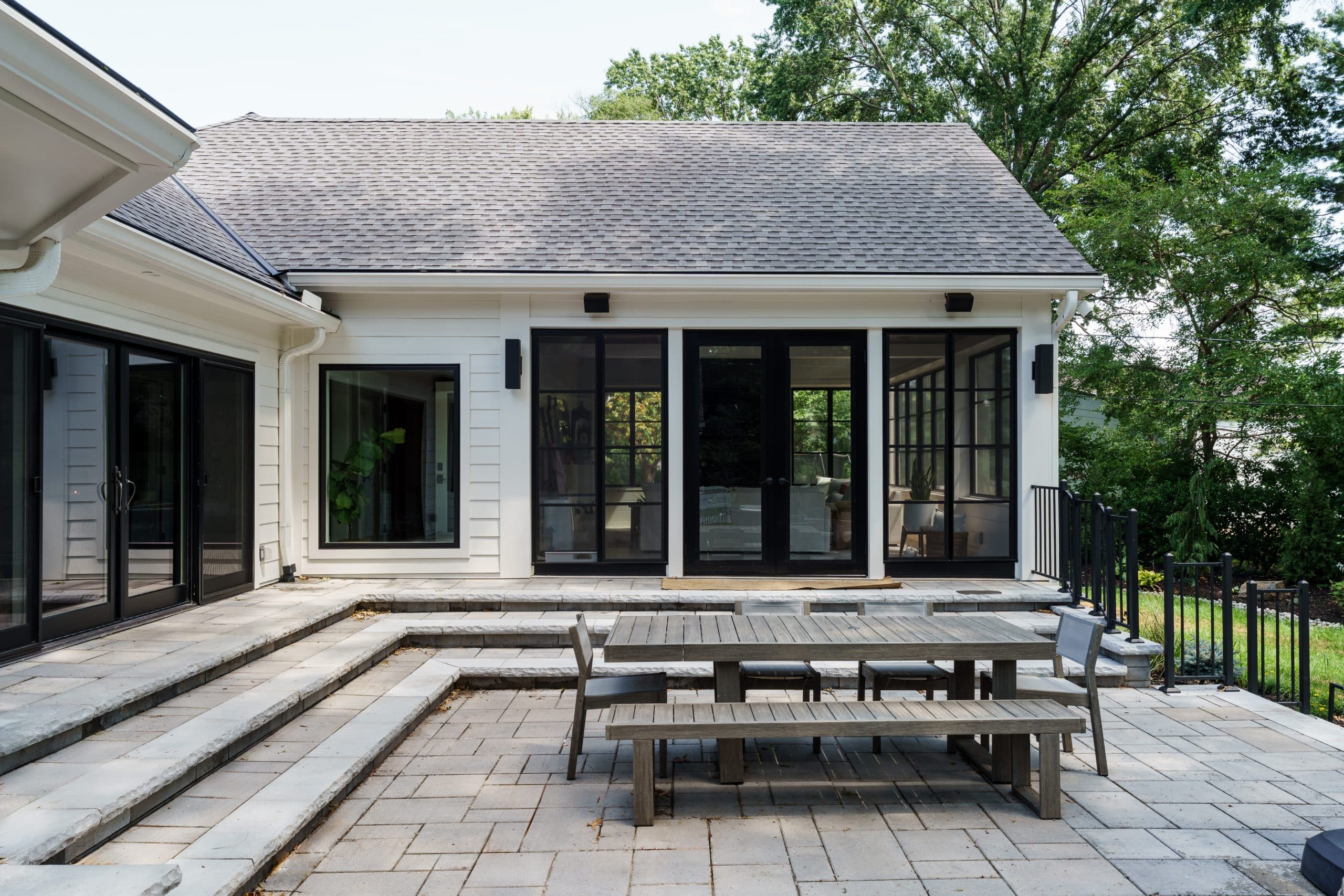 Screen porch addition exterior view of Leawood home that blends seamlessly with the existing Screen porch addition exterior view of Leawood home that blends seamlessly with the existing