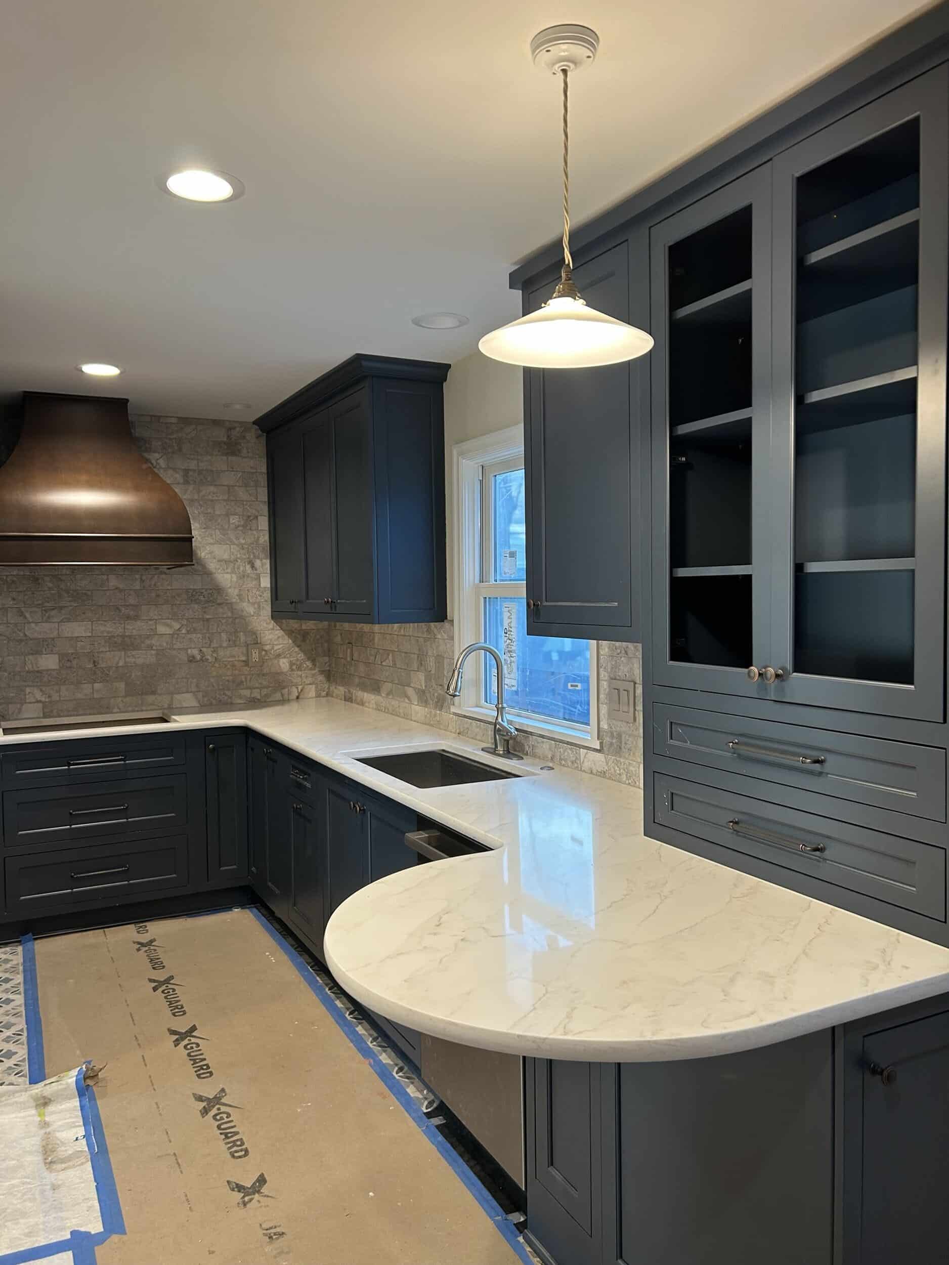 counters and light fixtures installed in Fairway remodel