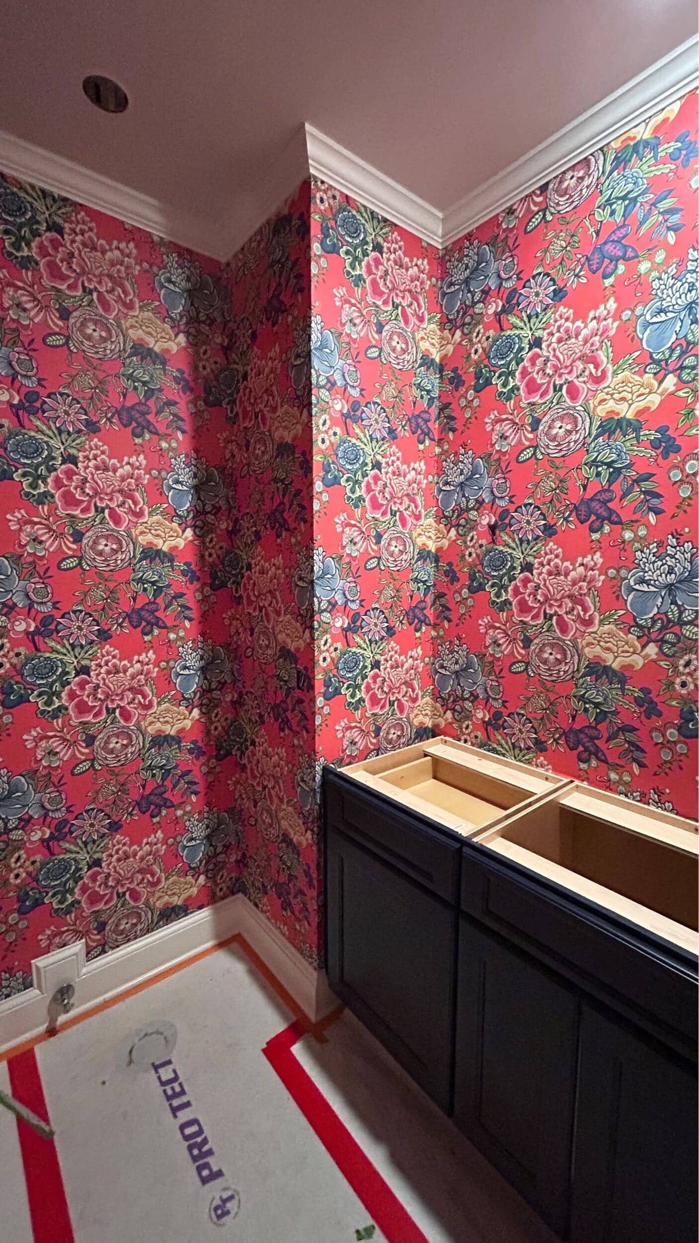 wallpaper installed in Grandmillennial hall bathroom remodel