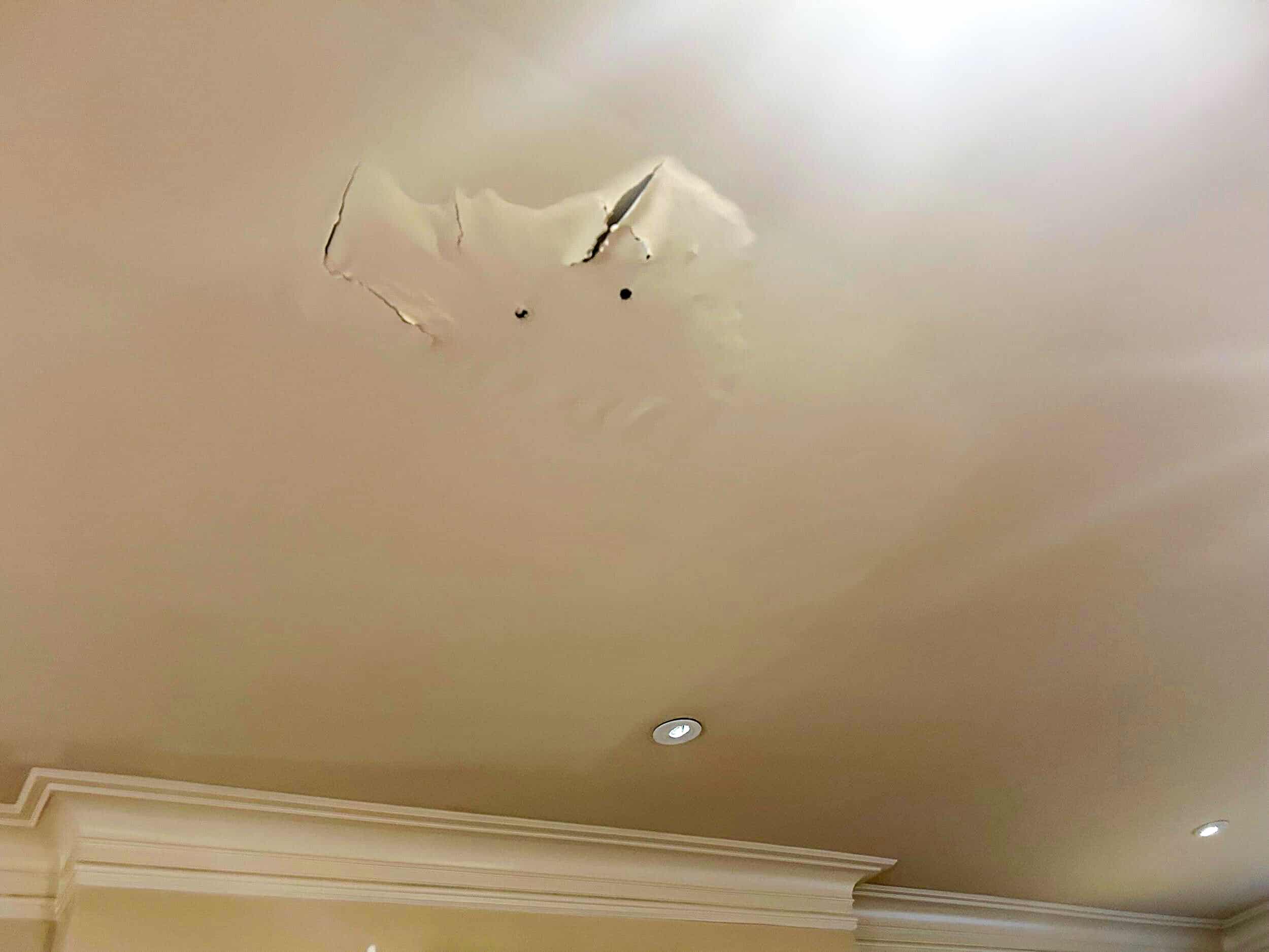 Bubbling paint from water damage in older KC home Water damage in Kansas City older home ceiling