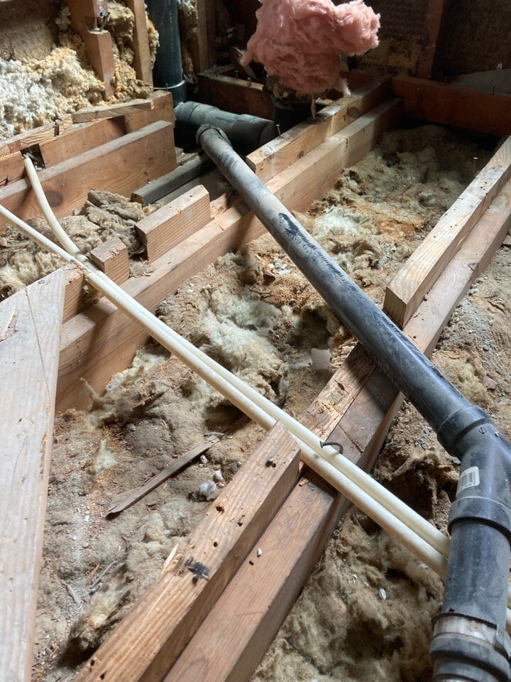 Cut floor joists on previous project Floor joists cut and altered around plumbing during previous work in an older home.