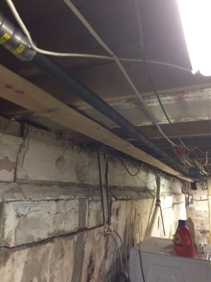 Foundation issue in older KC home Basement walls that appear to bow inward may indicate foundation issues