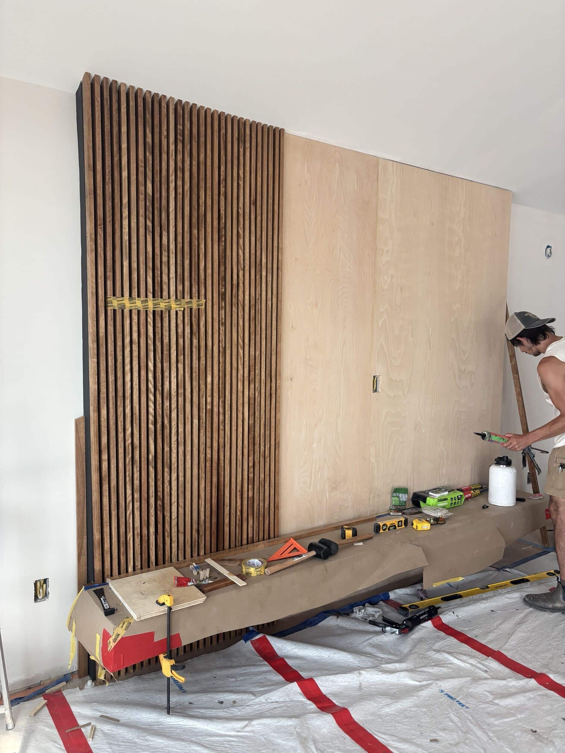 custom wood panel slat wall for media feature wall in lake of the ozarks home remodel