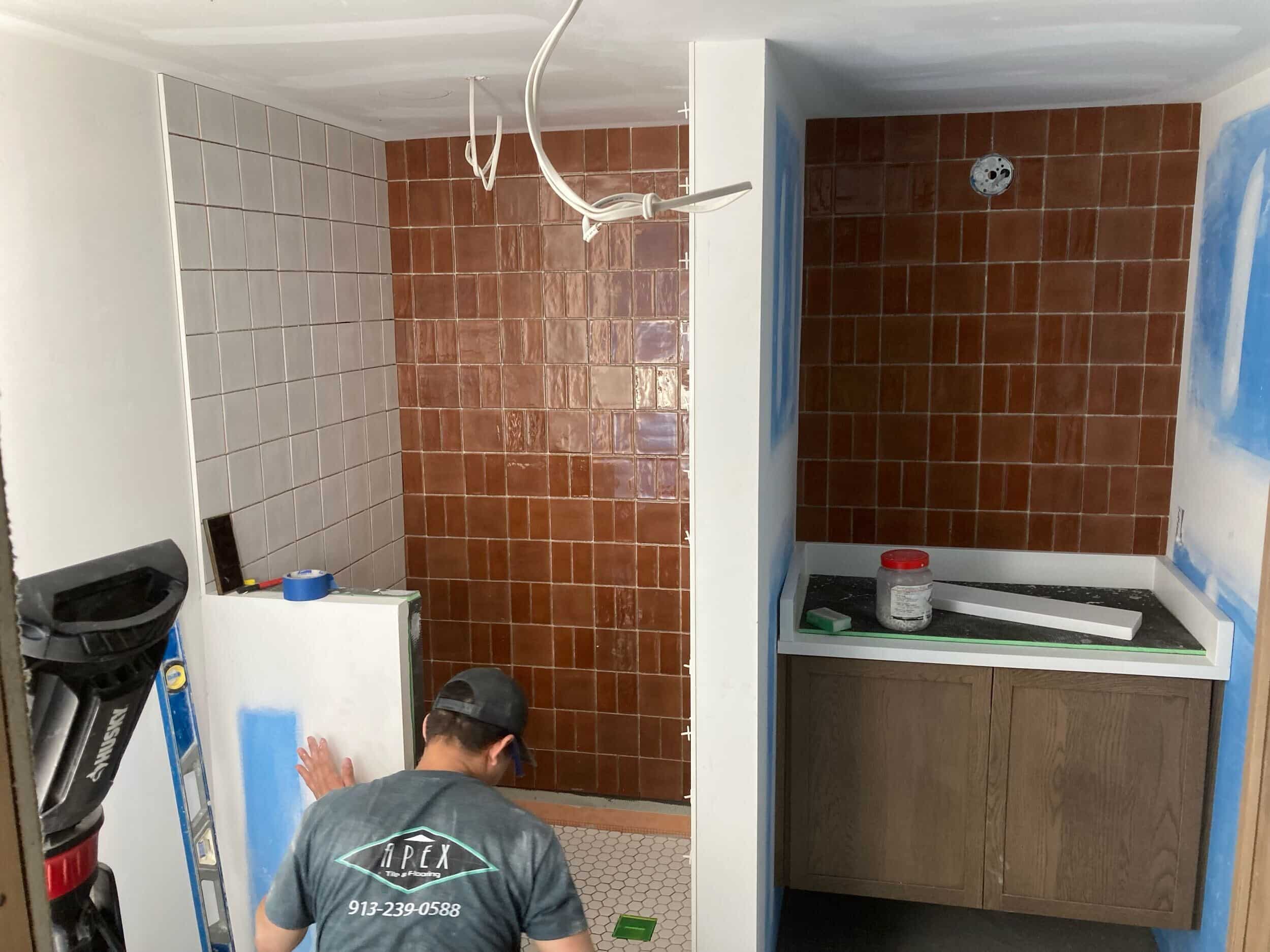 tile and warm design elements in lake home bathroom remodel