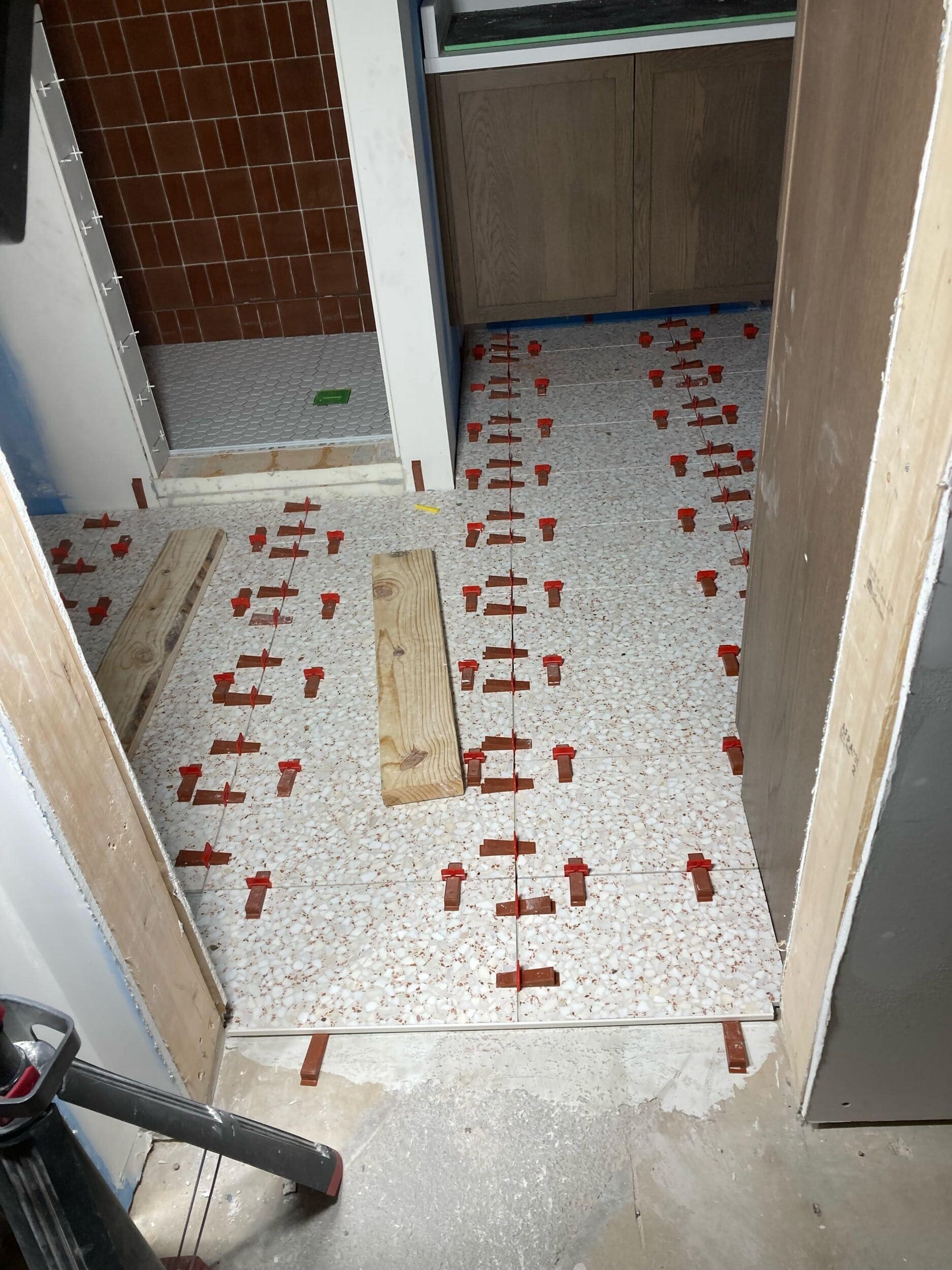 terrazzo floor tile in modern lake home bathroom remodel