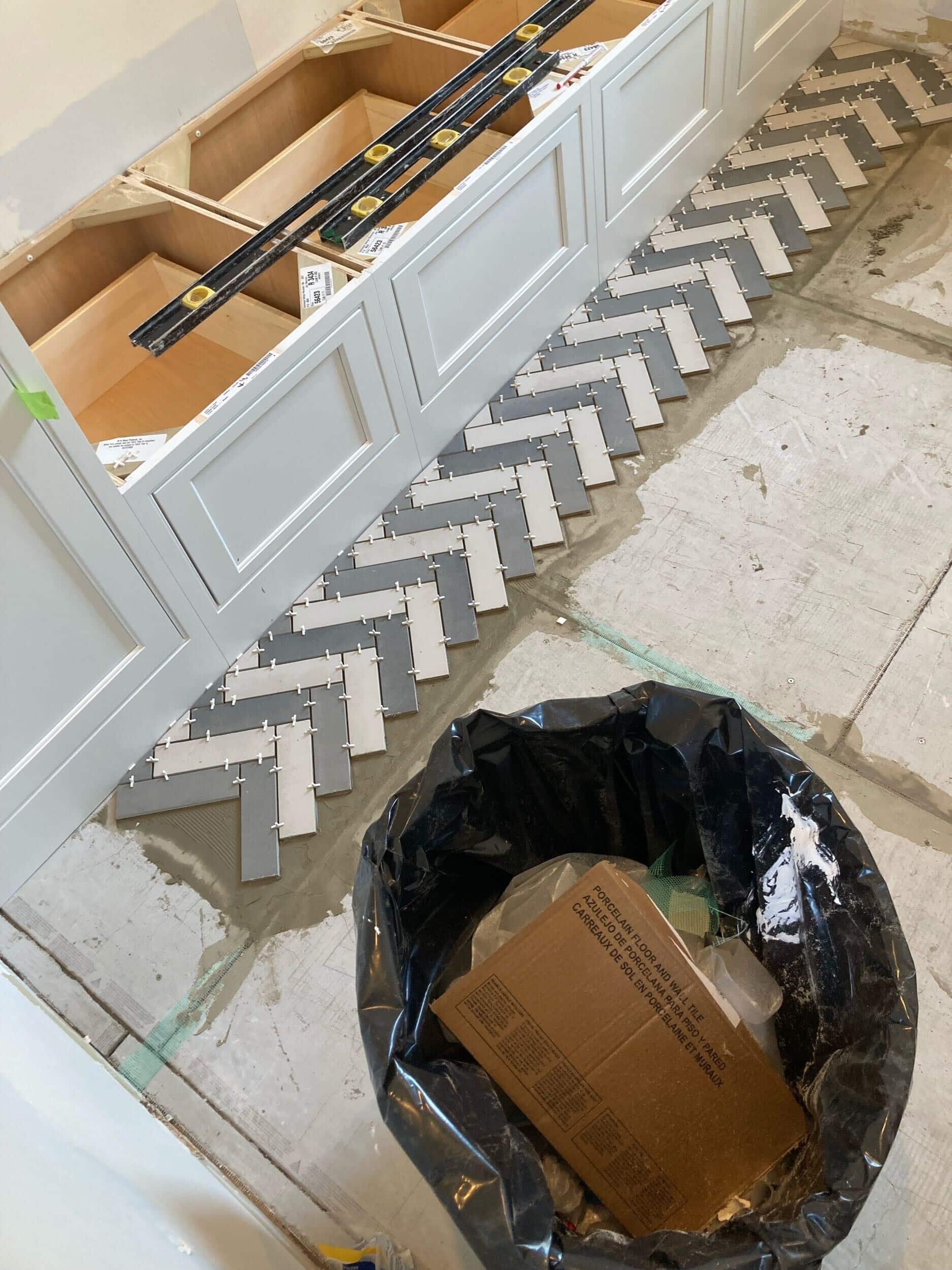 handyman team laying tile in mudroom project handyman team laying tile in mudroom project