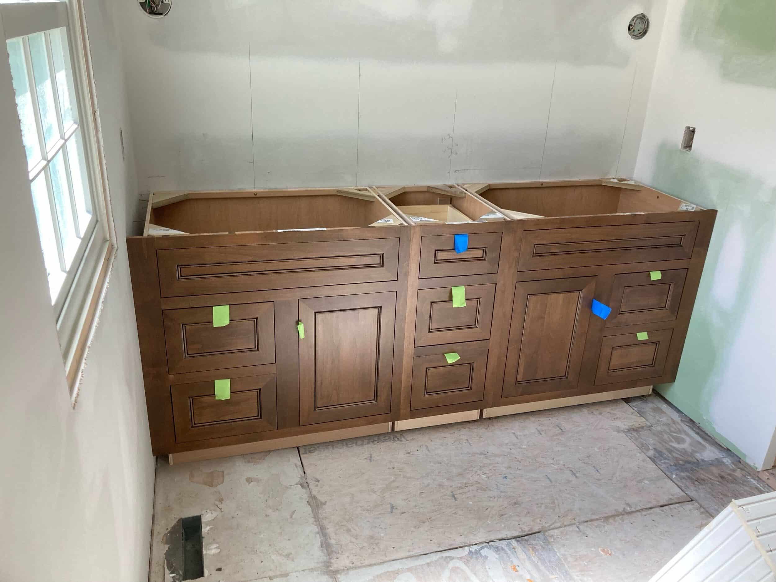 primary bathroom custom double walnut vanity install in Kansas City