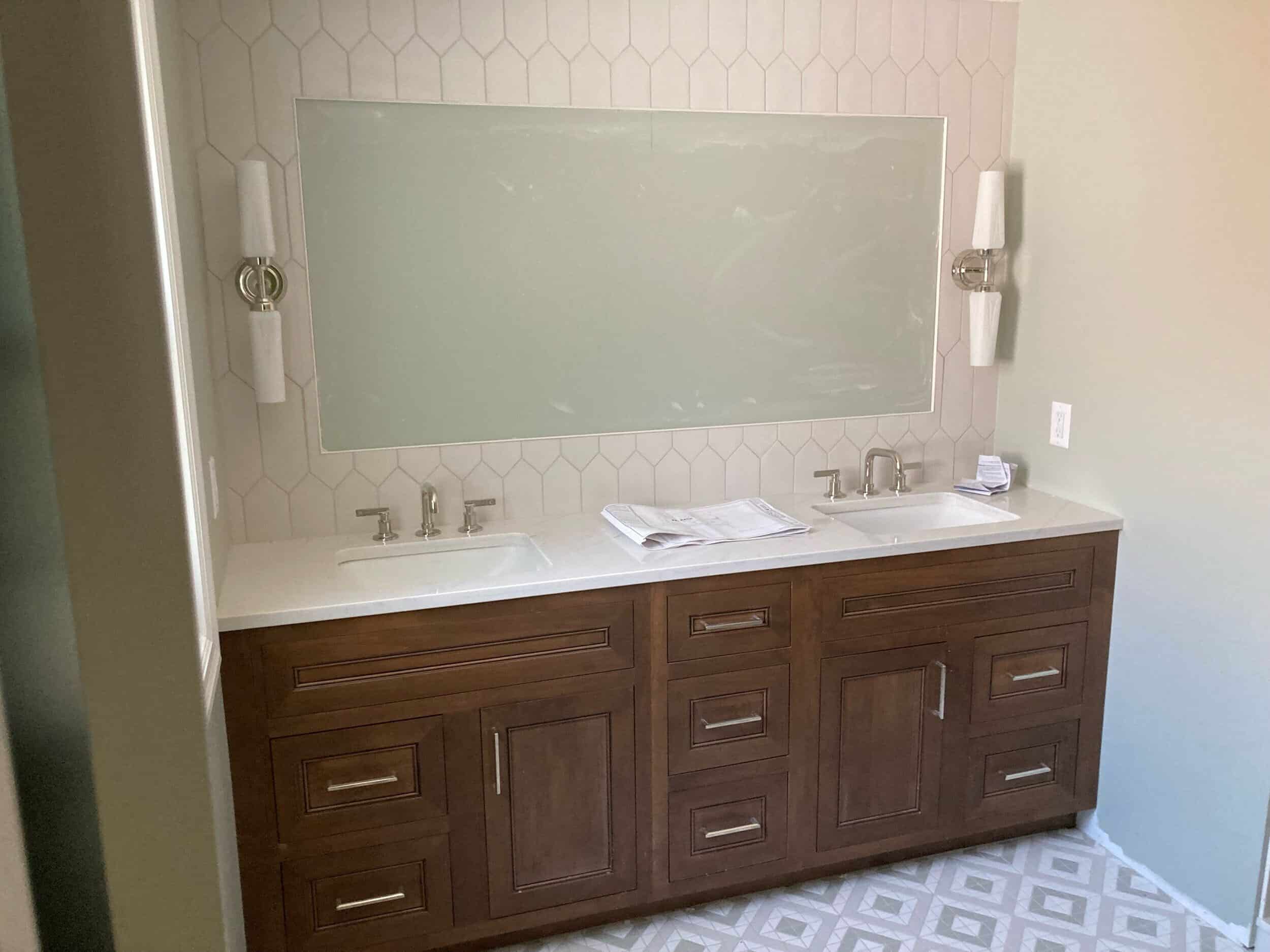 counters installed and plumbing finish in spa like primary bath remodel in tudor charming Kansas City home