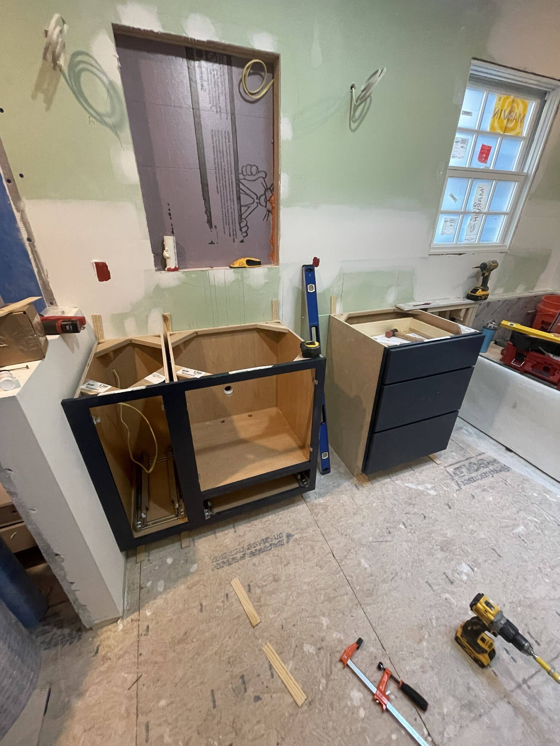 deep blue custom cabinetry for transitional primary bathroom remodel in Johnson County deep blue custom cabinetry for transitional primary bathroom remodel in Johnson County