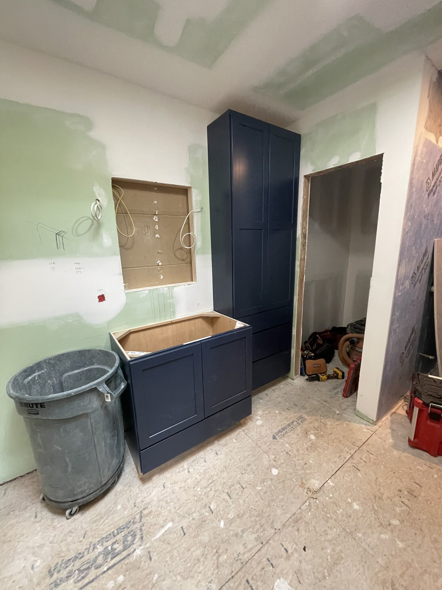 deep blue custom cabinetry for transitional primary bathroom remodel in Johnson County deep blue custom cabinetry for transitional primary bathroom remodel in Johnson County